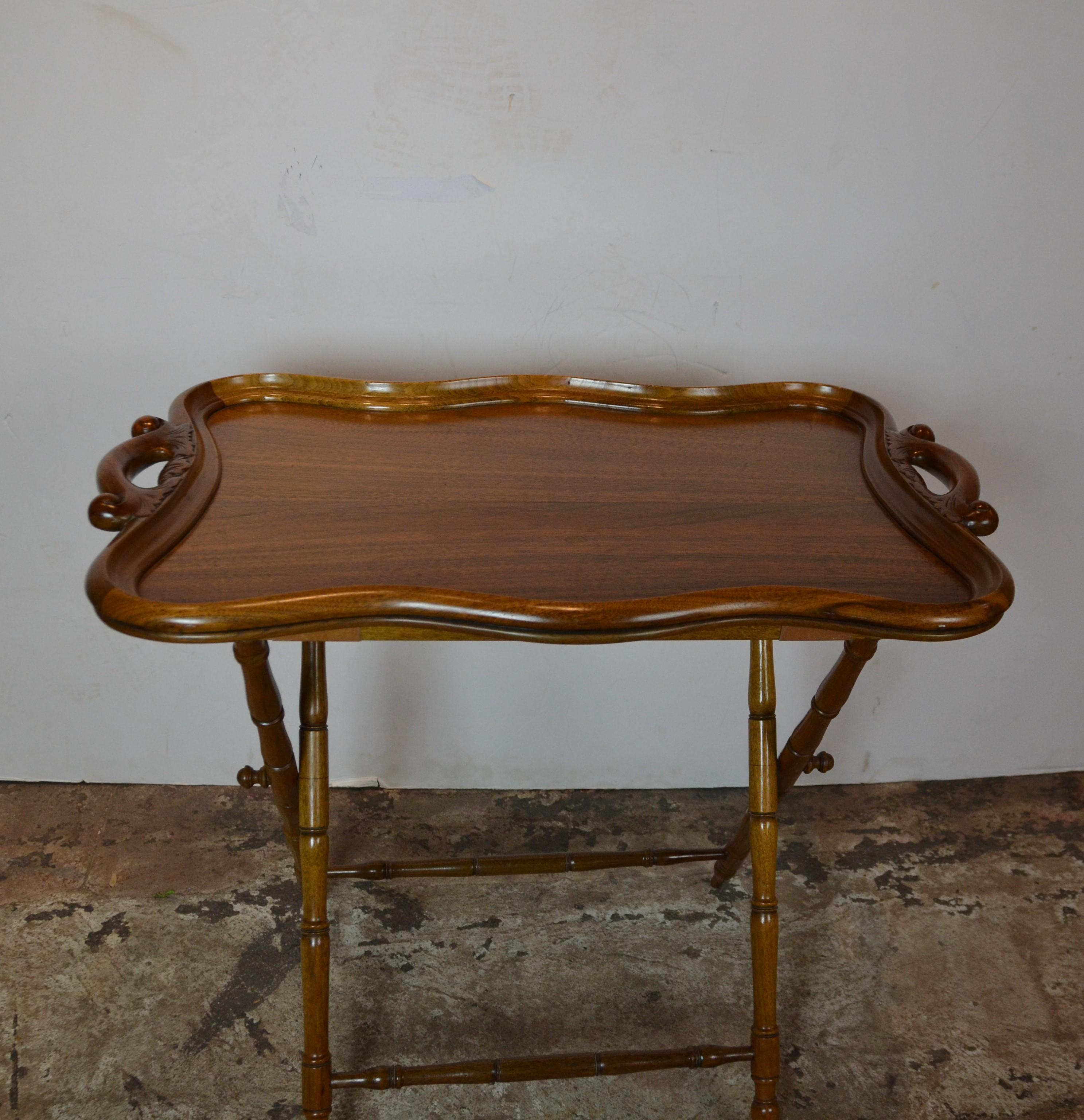 Fine quality walnut tray standing on a folding faux bamboo stand.