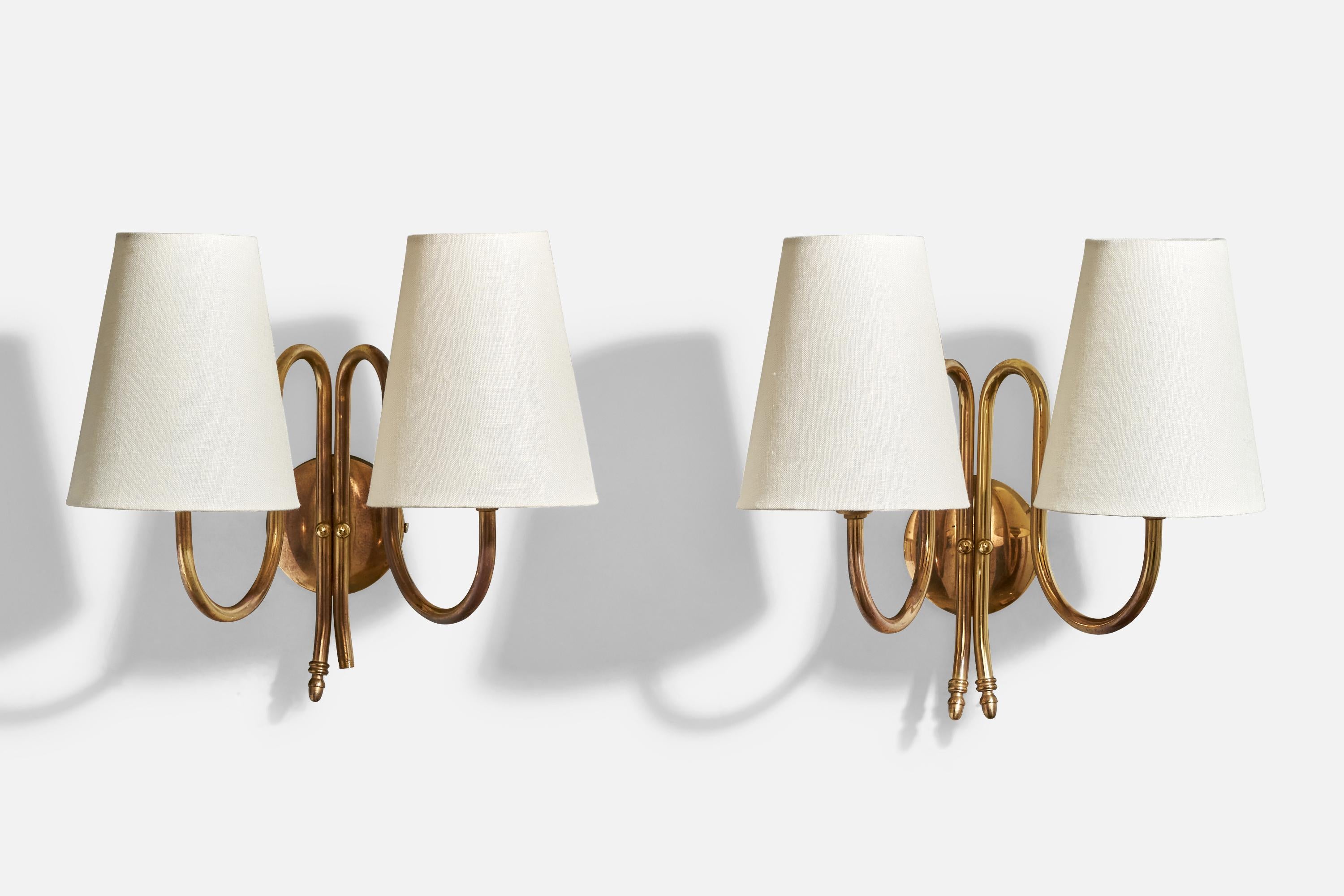 A pair of brass and white fabric wall lights produced by Tr&Co, Norway, c. 1960s.

Overall Dimensions (inches): 11.25” H x 11.25” W x 8.5“ D

Back Plate Dimensions (Inches): 3.25” H x 3.25” W x 1” D

Bulb Specifications: E-12, E-14, E-26