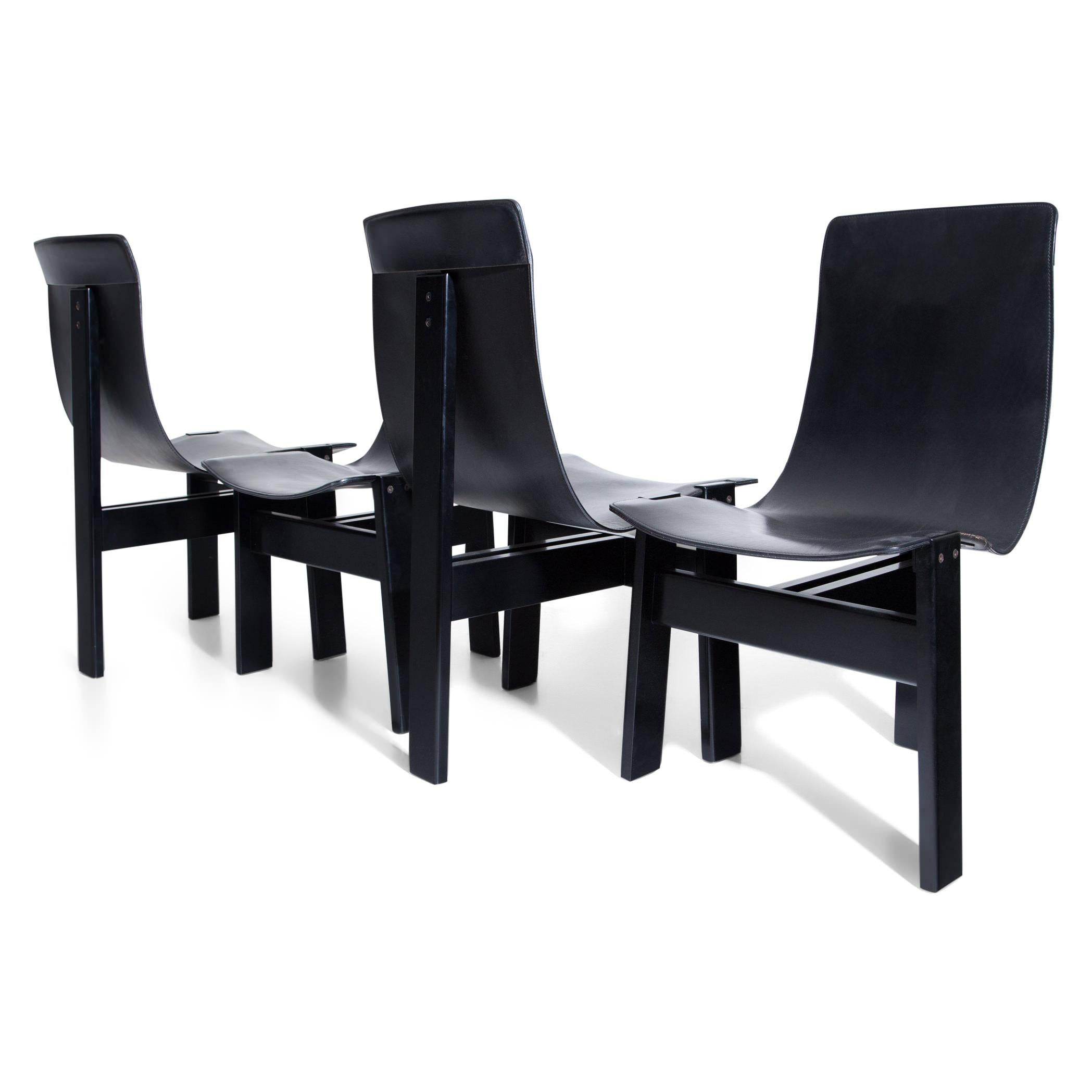Set of four black TRE 3 chairs designed by Angelo Mangiarotti in 1978. The seat is covered with leather.