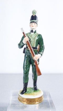 Three porcelain sculptures by RUDOLF KAMMER depicting three military personnel