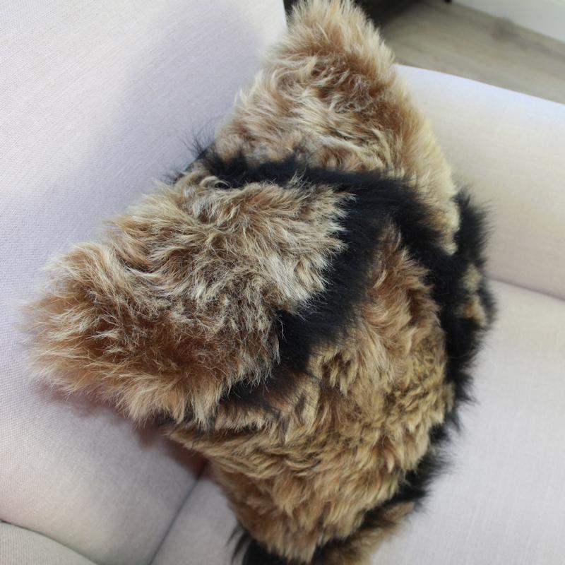 Add layers of comforting texture to your living room or bedroom decor with this exotic inspired sheepskin pillow designed by Emily Barbara and exclusive to 1st Dibs. Its unique design offers a contemporary flavour paired with irresistible cozy