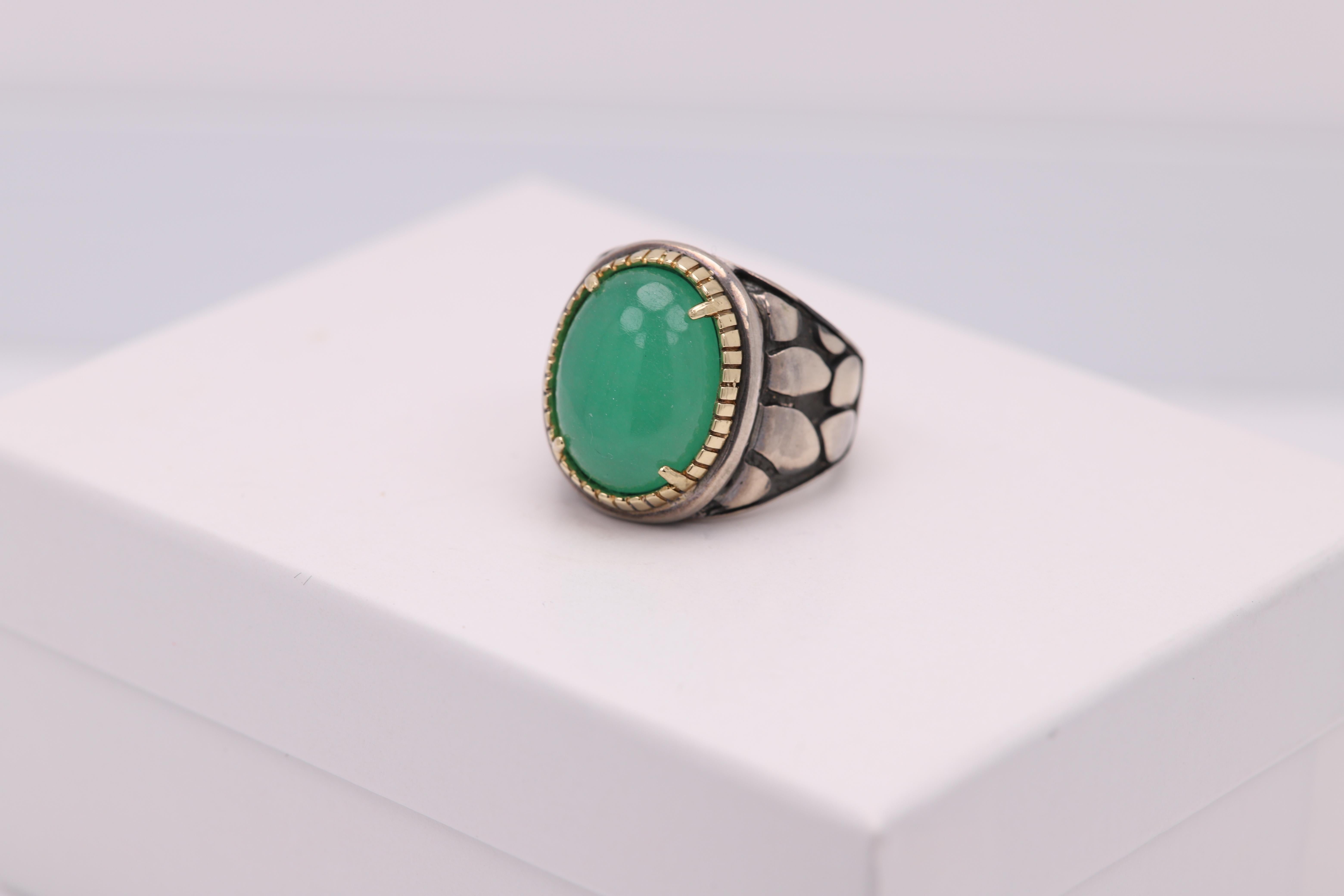 green jade rings set on gold and silver