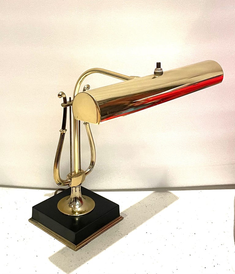Beautiful and rare polished brass musical note /harp desk table lamp, by Laurel Lighting Company circa 1950s fluorescent light bulb excellent condition almost never used, retains its original label with manufacturer name. With movable shade up and