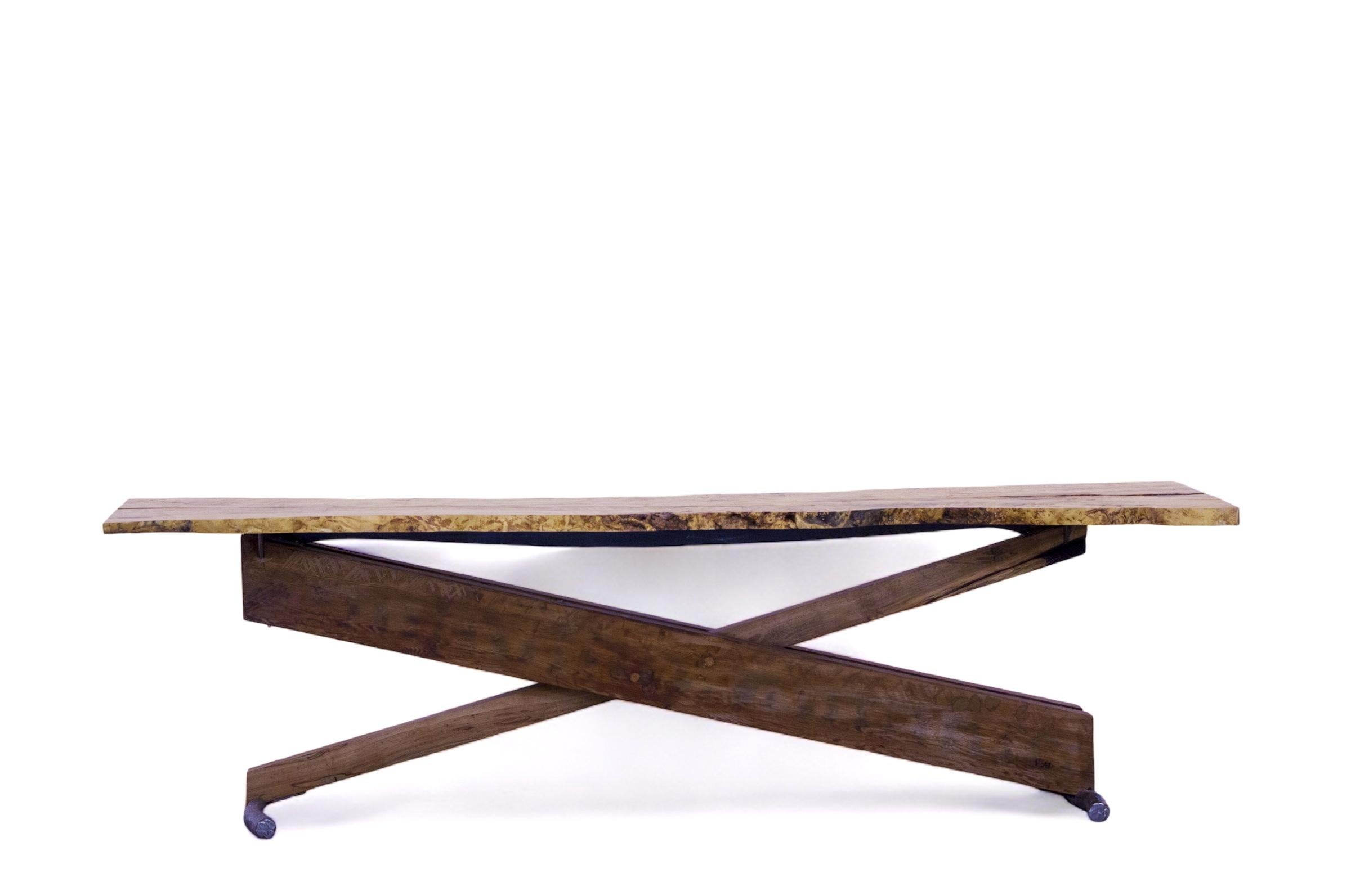 Our Trebuchet Table was created to have the aesthetic of the catapult of olden times, the slab chosen for this top is box elder a wood of the maple species this slab was dried and hand finished to have a rustic feel, the base of this beautiful piece
