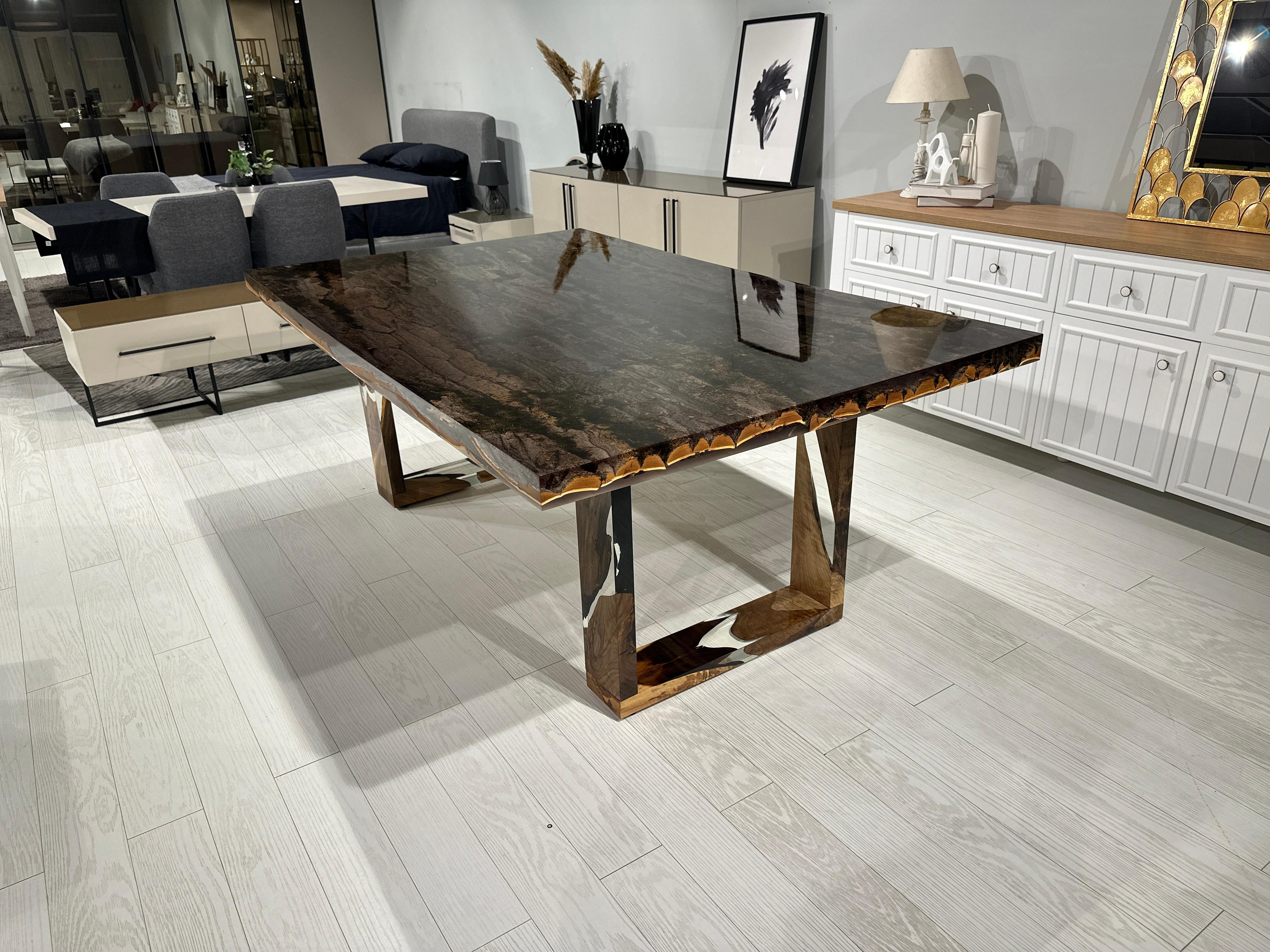 Tree Bark Clear Epoxy Resin Dining Table 

This table is made of poplar tree's bark. The grains and texture of the bark describe what a poplar bark looks like.
It can be used as a dining table or as a conference table. Suitable for indoor use.

All