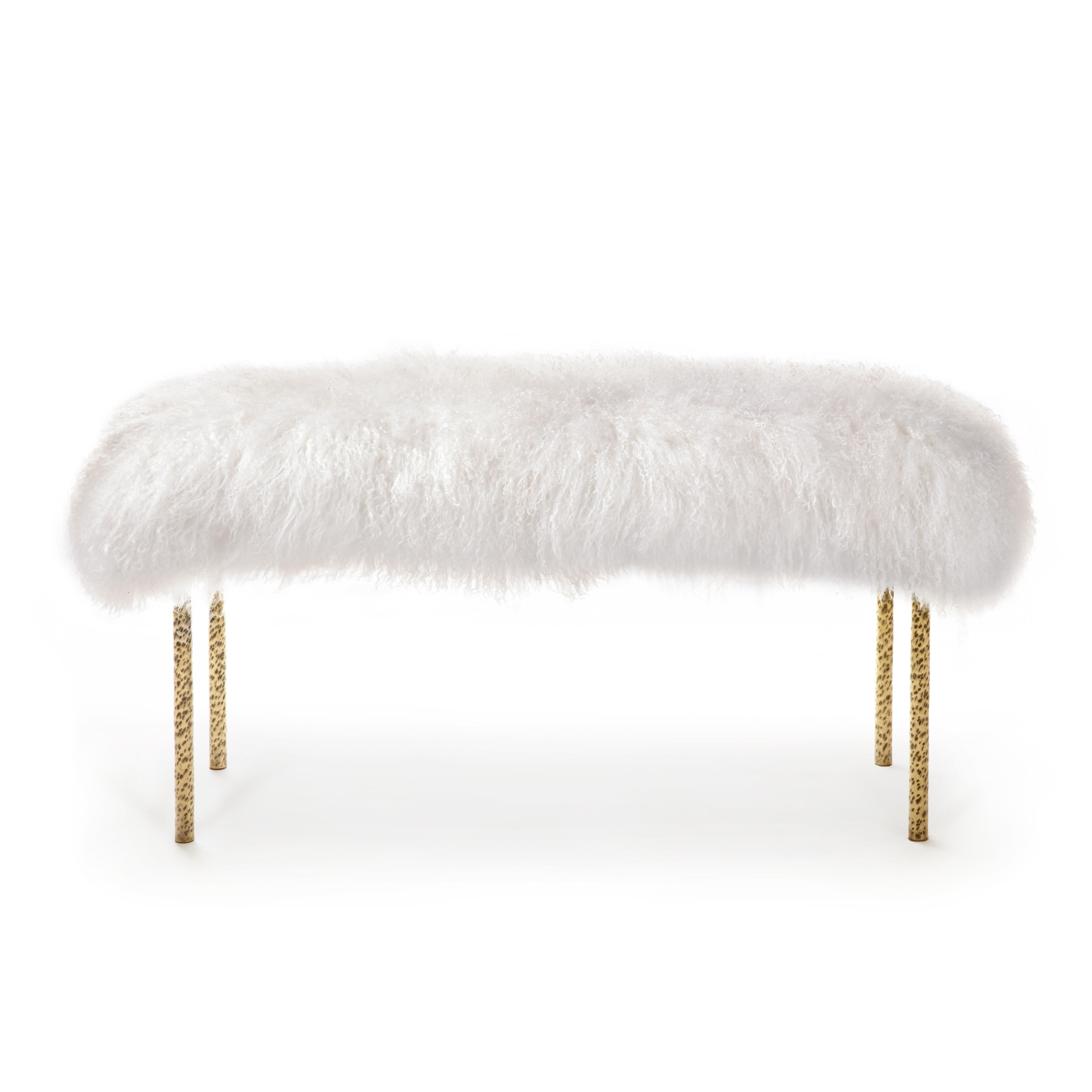 The Tree Branches long bench is entirely handcrafted in brass with a hammered technique similar to the irregular details of real branches.
The top in Mongolian Lamb fur completes this creation by evoking the wild side of nature. Thought to be