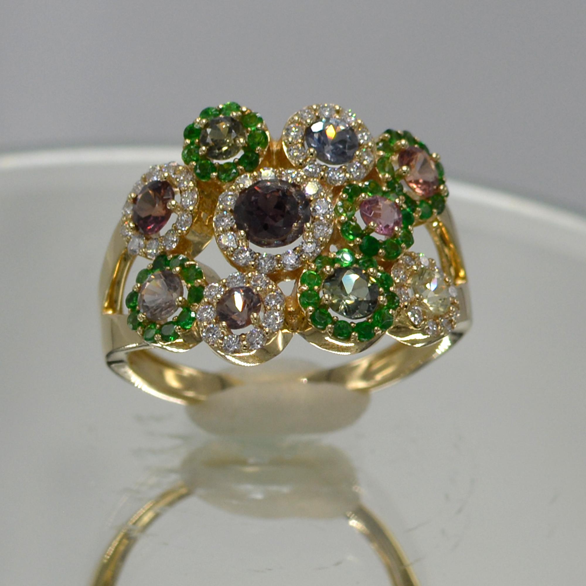 authentic Montana Sapphire Flower Ring, mix color shades plus diamonds & green stavorite Stones,
14k rose gold 4.60 grams, Total Montana sapphire 1.17 carat, total stavorite 0.43 carat,
Total Diamonds 0.30 carat F-G-VVS.
Finger size 7
all stones are