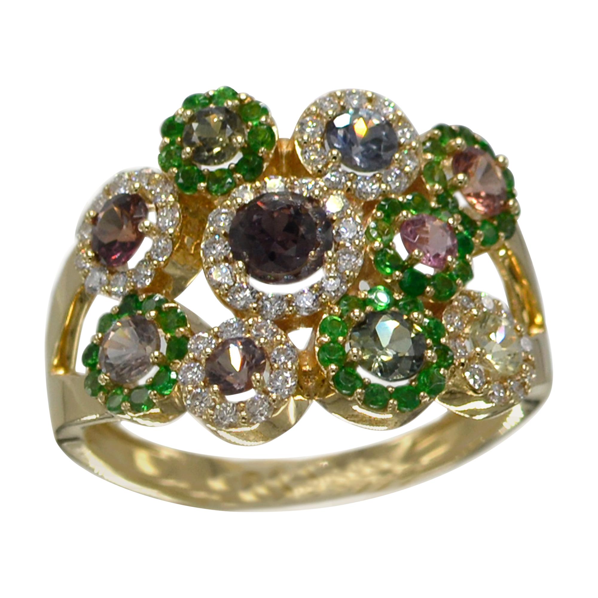 authentic Montana Sapphire Flower Ring, mix color shades plus diamonds & green stavorite Stones,
14k rose gold 4.60 grams, Total Montana sapphire 1.17 carat, total stavorite 0.43 carat,
Total Diamonds 0.30 carat F-G-VVS.
Finger size 7
all stones are