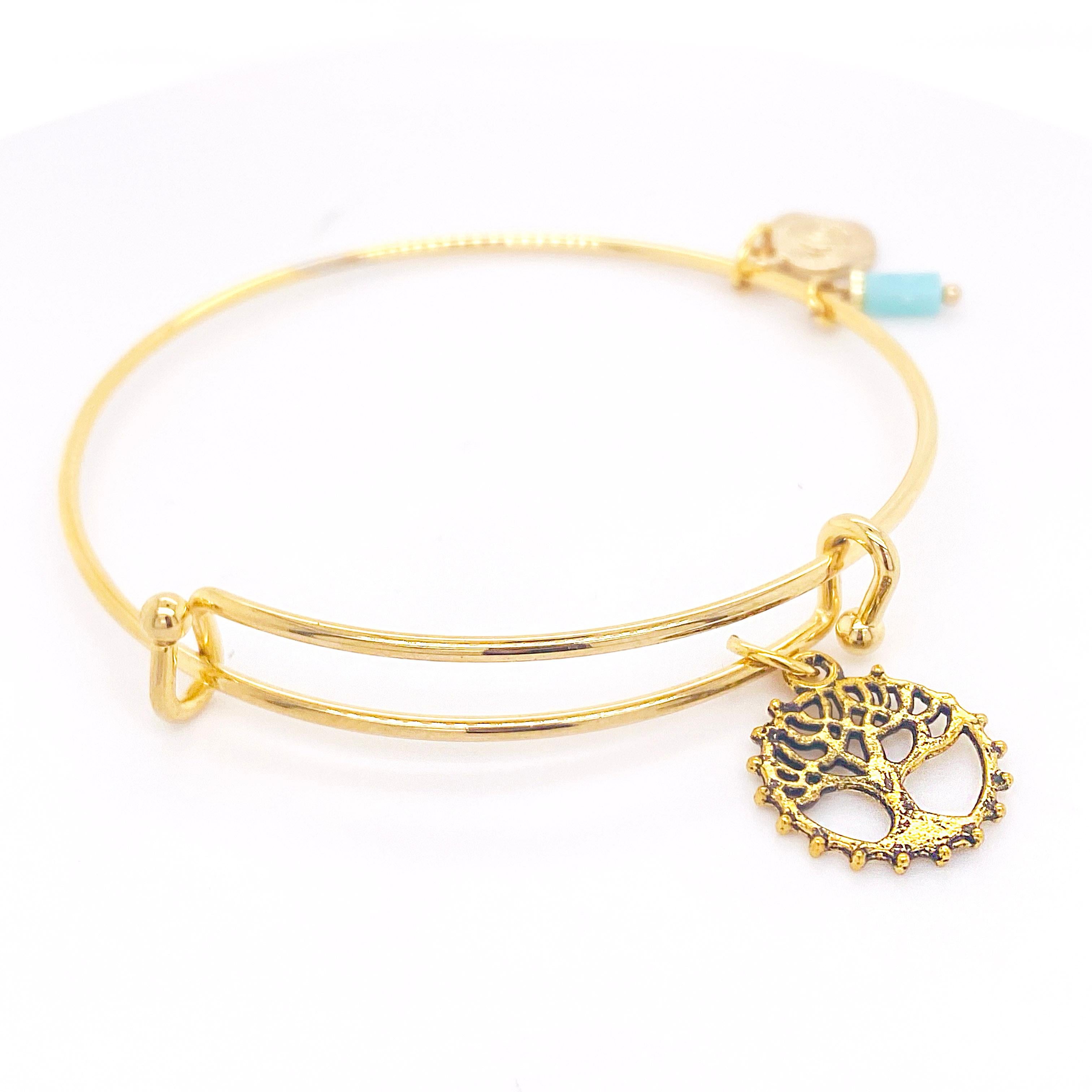 Tree of Life Bracelet representing the family tree! The tree is perfect to represent your family roots.This bracelet is gold overlay. Give this bracelet to everyone in your family or all your friends! The bracelet is adjustable and can fit on most