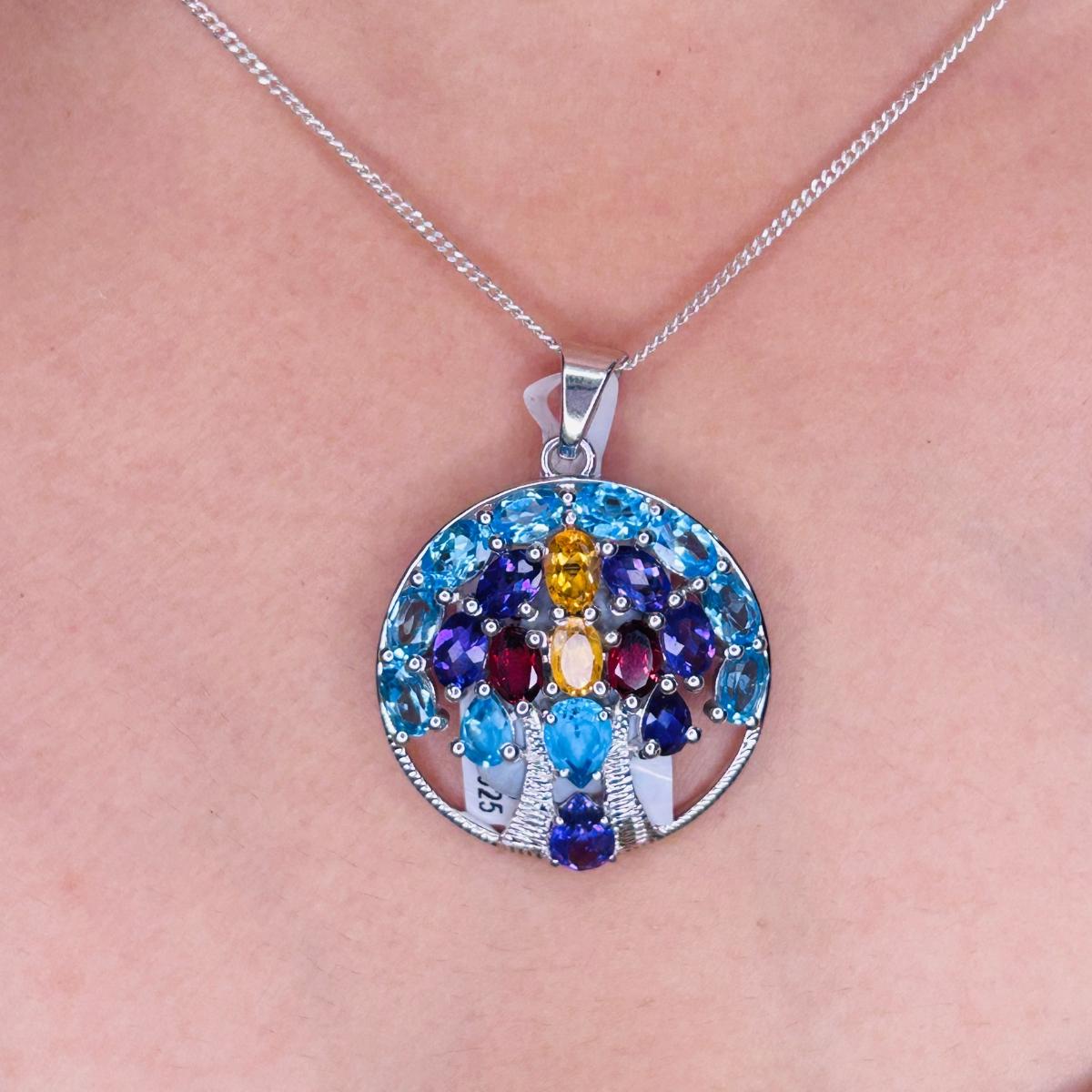 Tree of Life Multi Gemstone Circle Silver Pendant for Engagement Gift in sterling silver studded with round cut multi gemstone. This stunning piece of jewelry instantly elevates a casual look or dressy outfit. 
Multi Gemstone enhances the