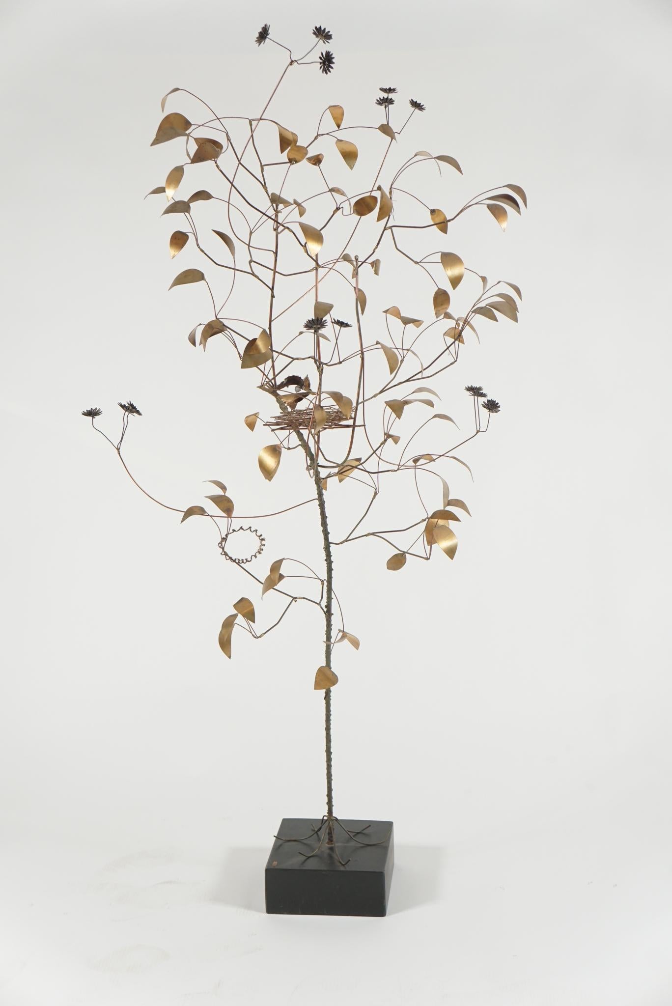 A stylish Mid-Century Modern sculpture by American sculptor Curtis Jere, in copper, a large tree with bird's nest and hovering mother bird, on a black lacquer stand, signed and dated 'Jere 69'.
 