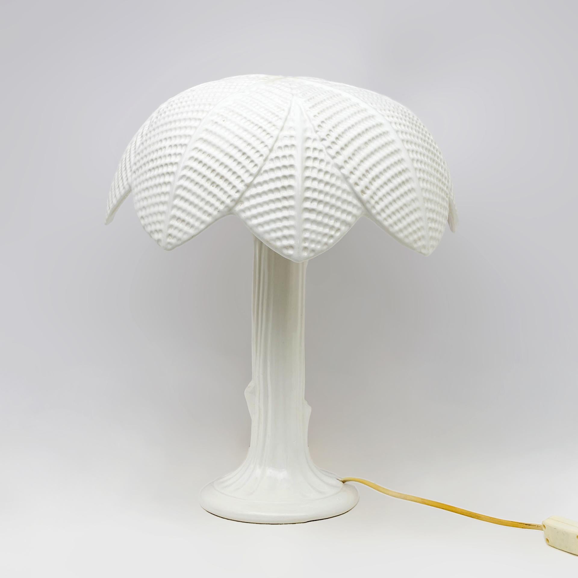 Beautiful 70s designer table lamp Tommaso Barbi for Bizzirri ceramiche.
Made from a single piece of white glazed ceramic in the shape of a palm tree.
There is a small crack as visible in the photos and signs due to age.