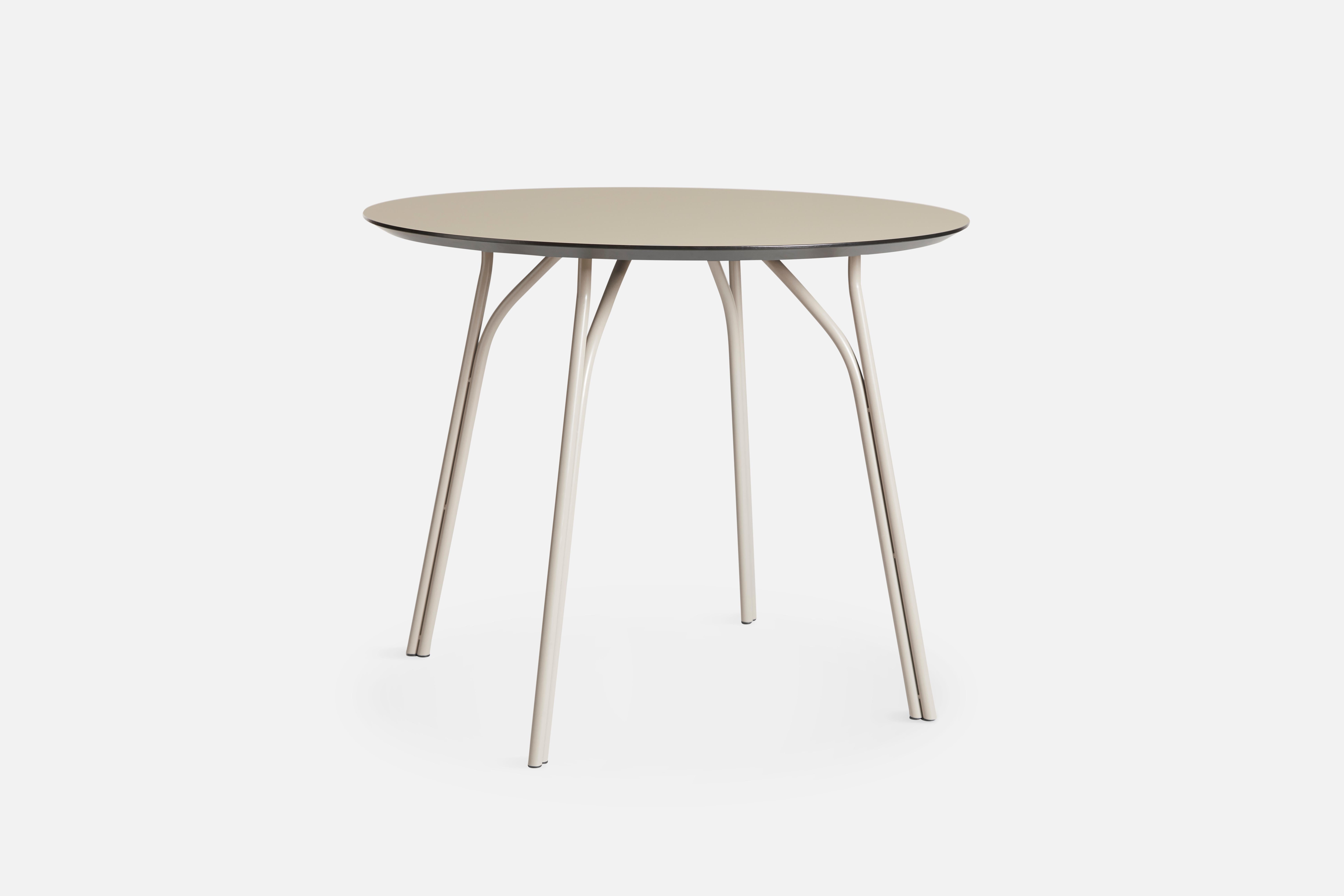 Tree small beige dining table by Elisabeth Hertzfeld.
Materials: Fenix laminate, metal.
Dimensions: D 90 x W 90 x H 74 cm.

The founders, Mia and Torben Koed, decided to put their 30 years of experience into a new project. It was time for a