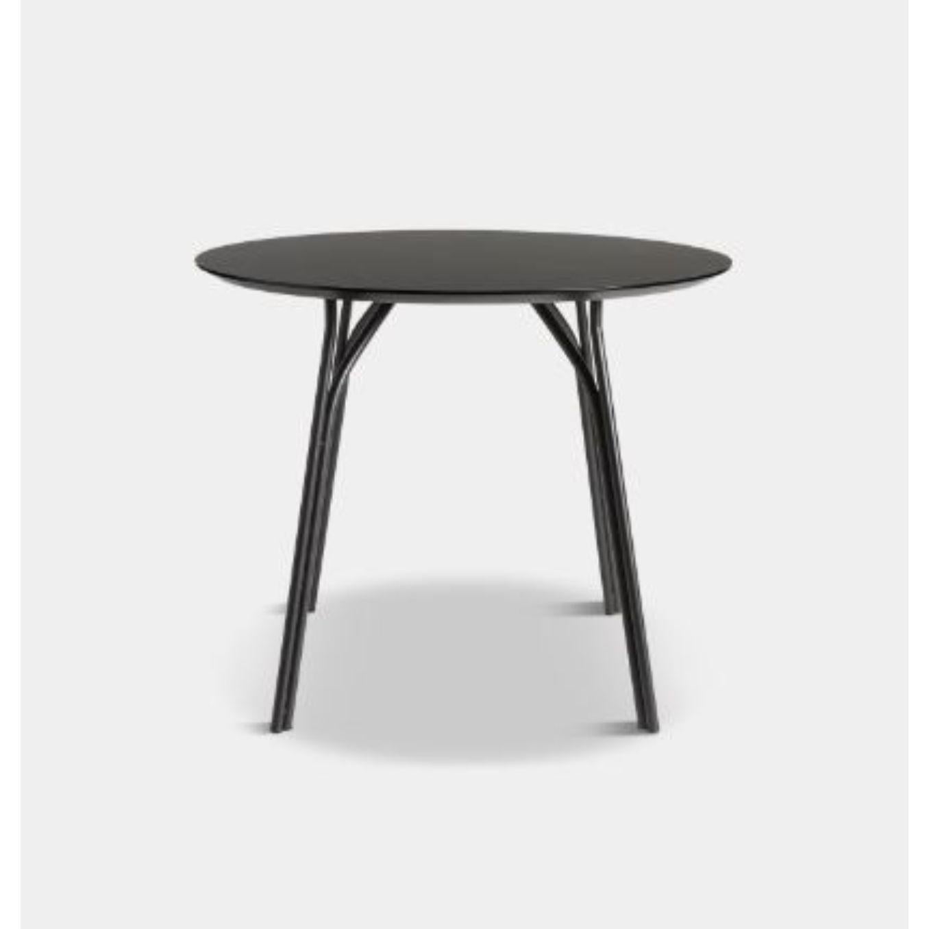 Tree small black dining table by Elisabeth Hertzfeld
Materials: Fenix Laminate, metal 
Dimensions: D 90 x W 90 x H 74 cm

The founders, Mia and Torben Koed, decided to put their 30 years of experience into a new project. It was time for a change