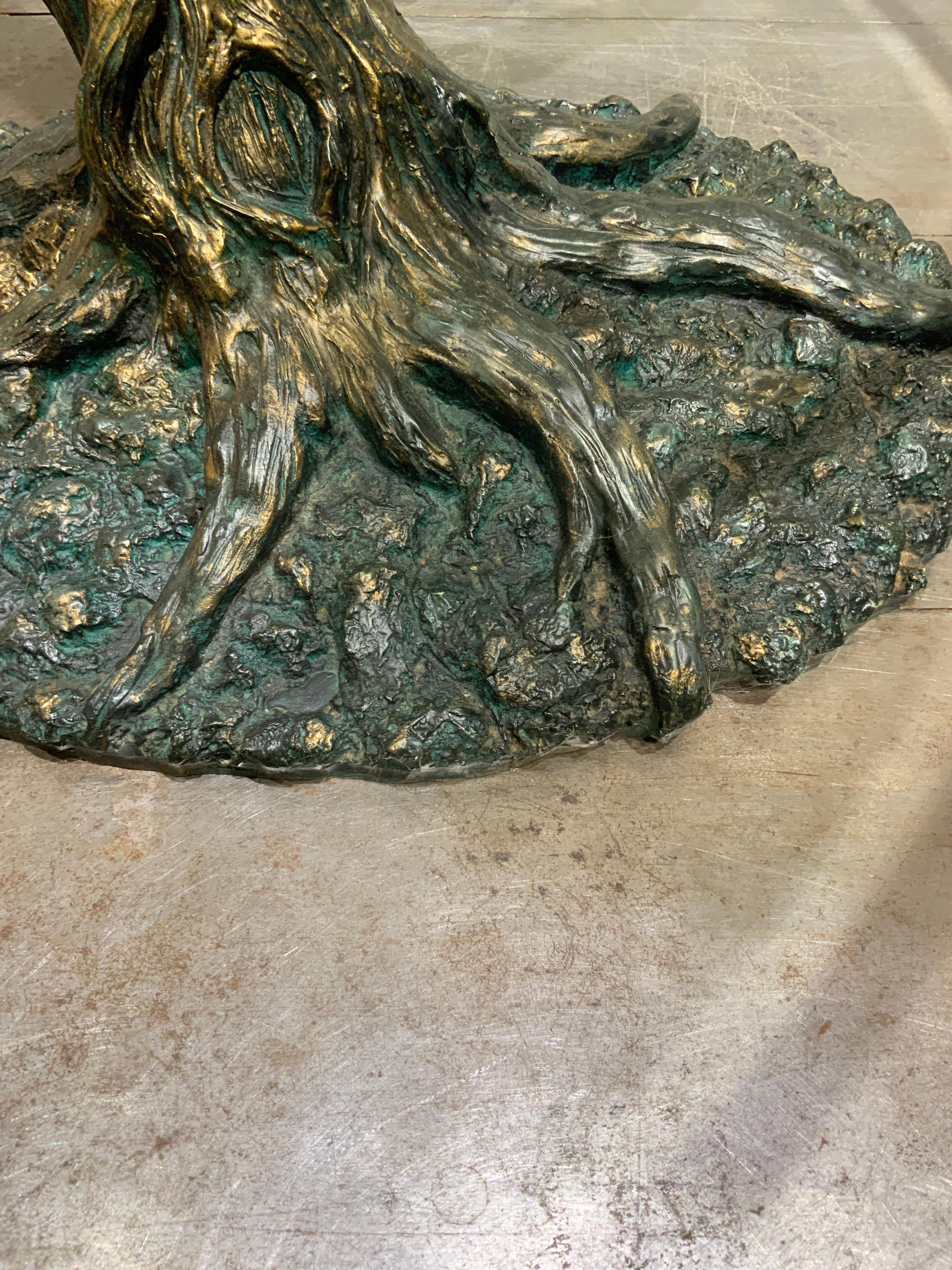 Wonderfull trunk tree table with glass top France circa 1970 
Center table or dining table very stable 
Solid base in resin with bronze patina 
Nice vintage condition 