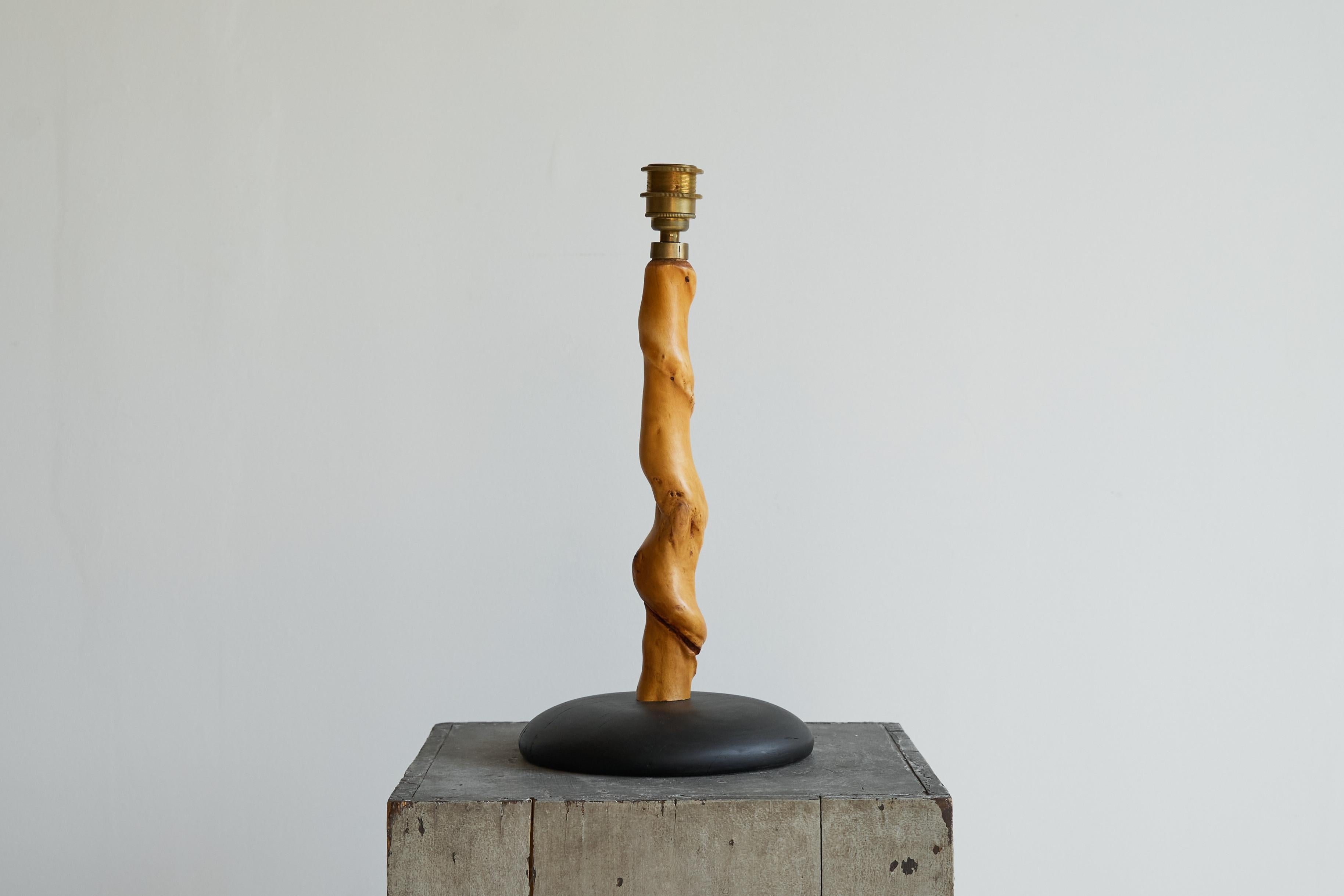Tree Trunk Table Lamp in Acacia and Oak, Europe, 1950s.

Unique and very distinct tree trunk table lamp. Base out of solid oak, which is acid-colored on a natural basis. The tree trunk is most likely from an acacia tree and has aged beautifully. The