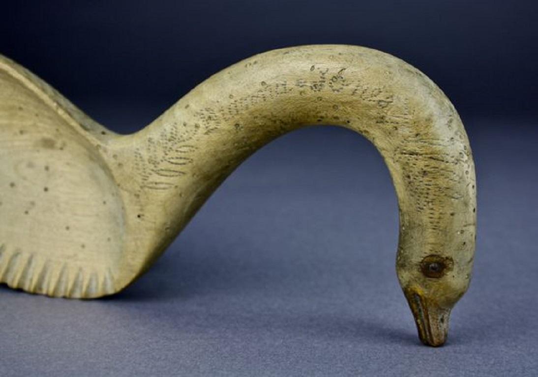 This charming Welsh sycamore butter curler is unusually modelled as a swan. It bears the name DiannaJones, The reverse with the date 1934.