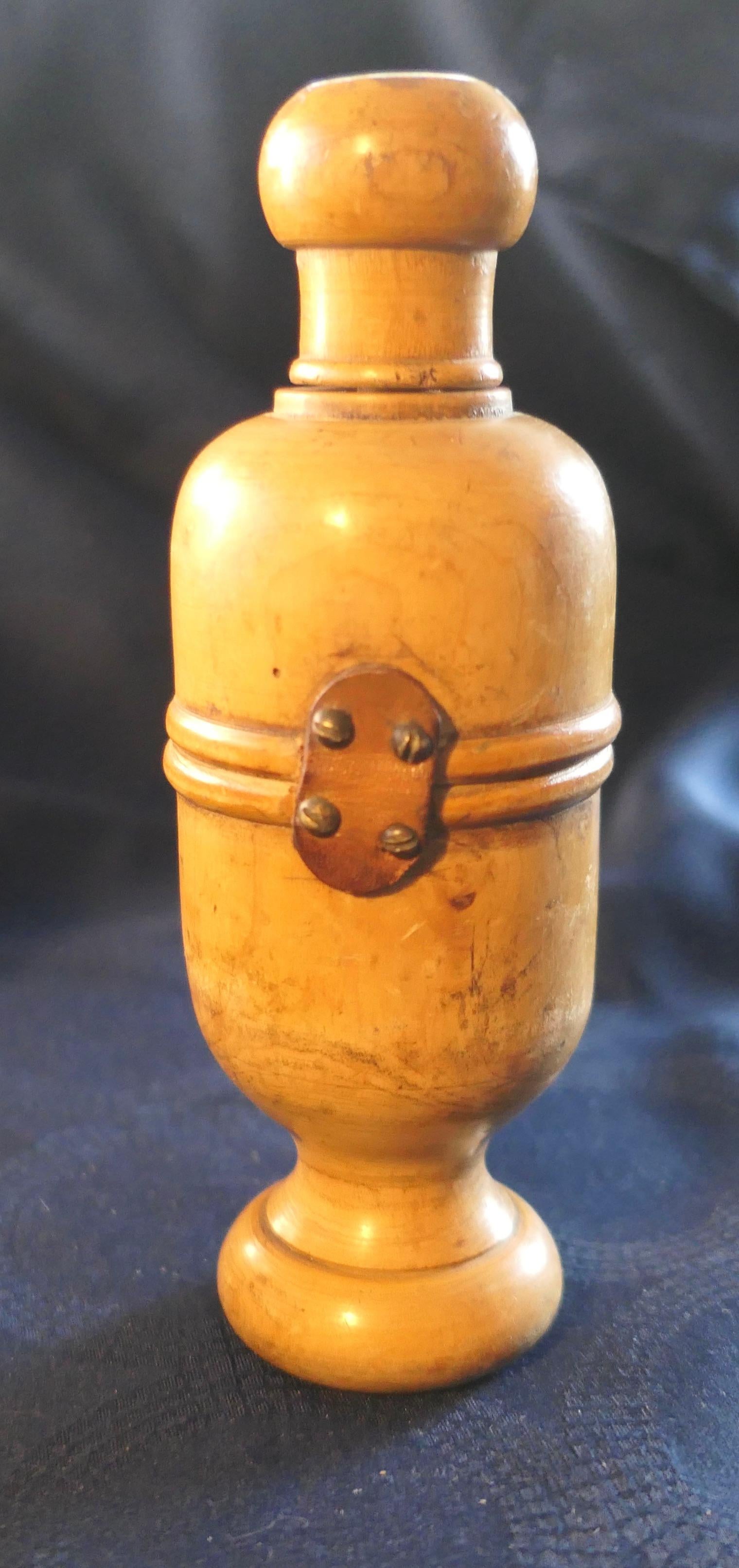 Treen Wine Bottle Corker or Cork Compressor  

This wonderful piece has been turned from Sycamore, it has a leather hinge which opens to access the1corking channel this has a metal liner
A wonderfully tactile piece with aged patina and in good