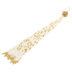 Used Treesure 18 kt yellow Gold and white Silk long Earring with diamond cutted beads