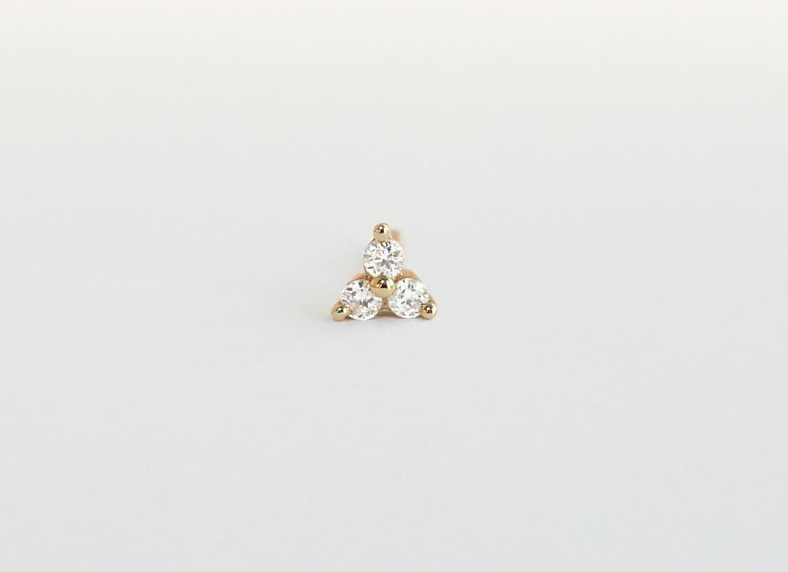 These delicate stud earrings feature three round brilliant white diamonds set in a trefoil design.  Measuring approximately 5mm across, they feature 0.11 carats of white diamonds set in 9-karat yellow gold with a post and butterfly closure. 