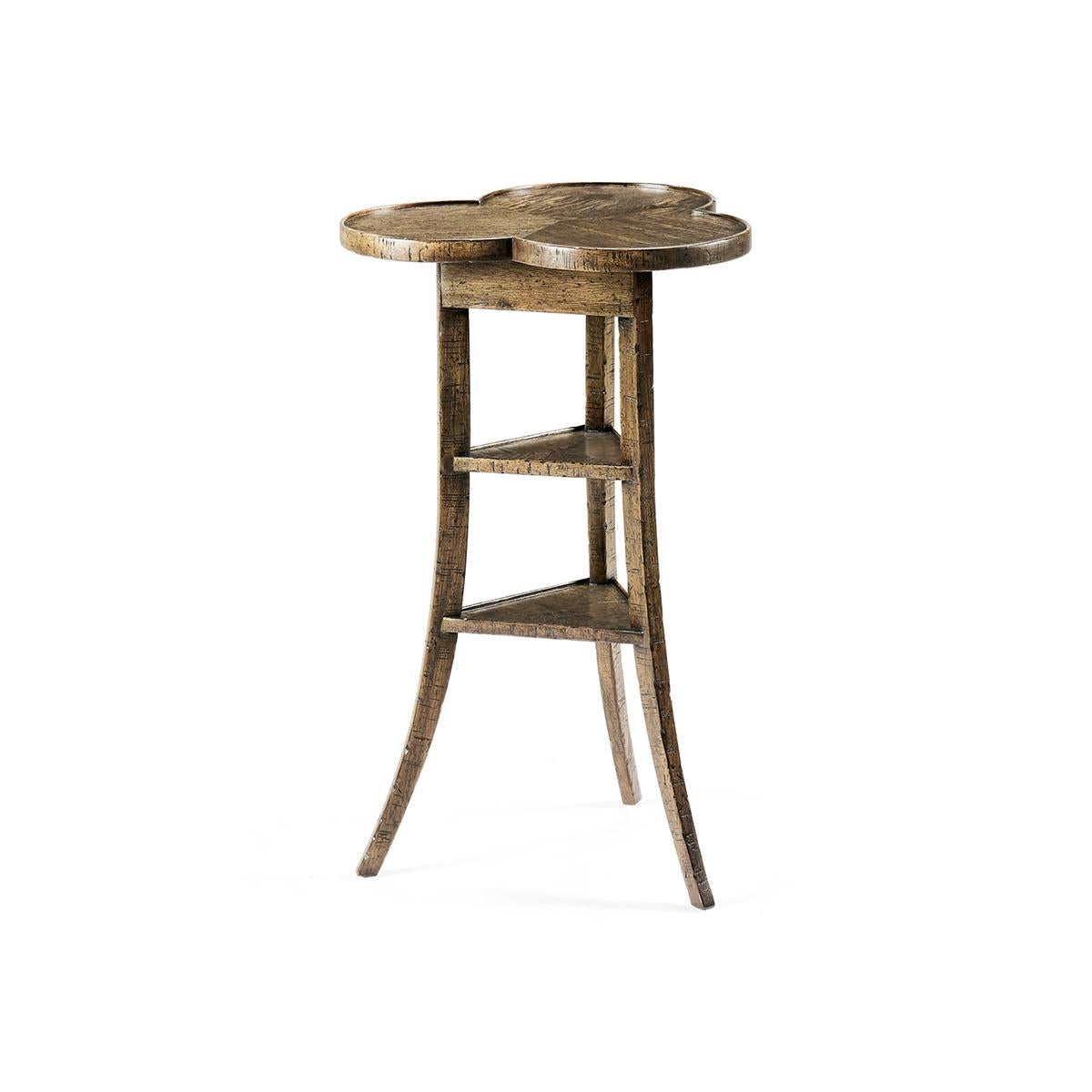 Trefoil Three-Tier side table, a heavily distressed side table with a trefoil top mounted on three splayed legs around two triangular shelves in a medium drift finish.

Dimensions: 16