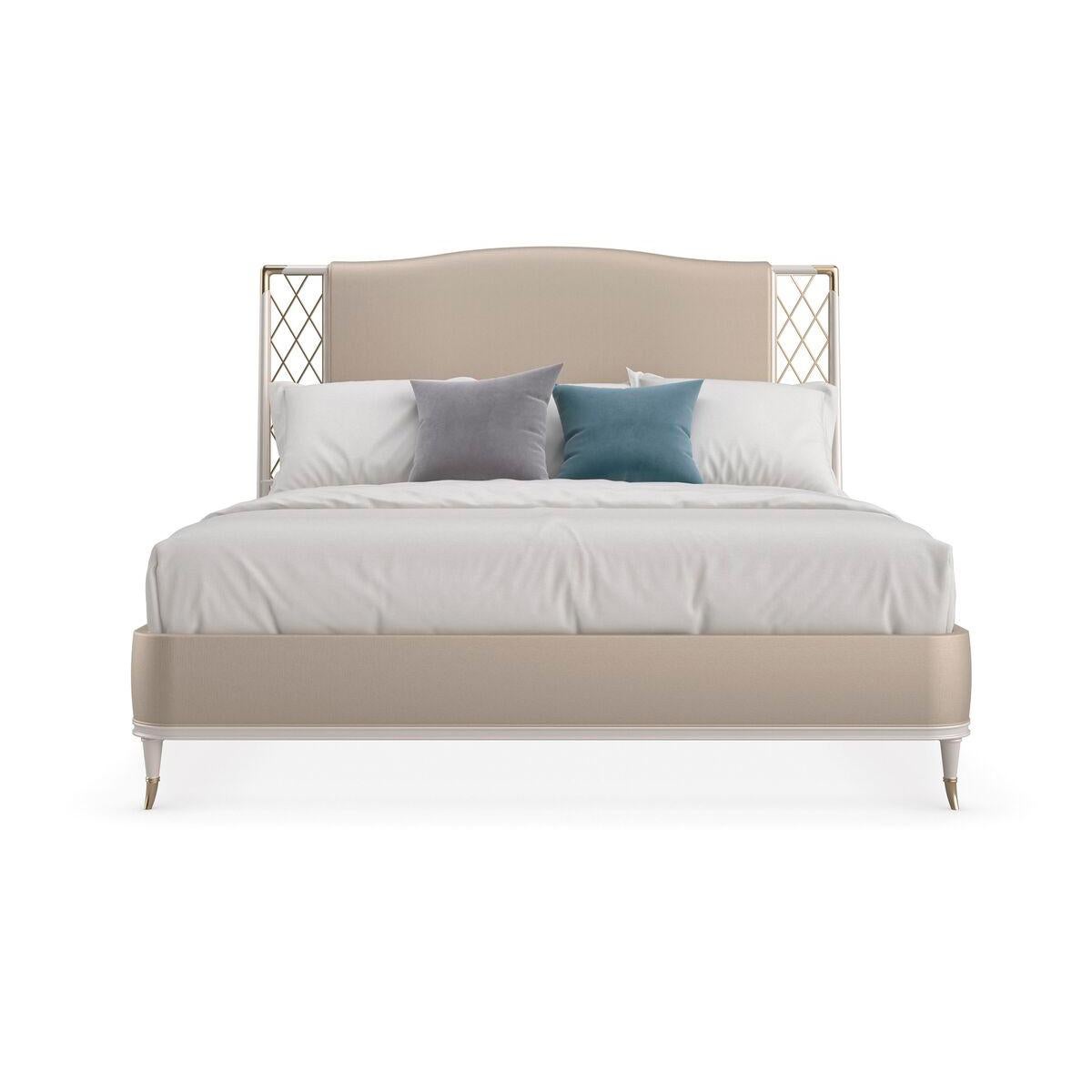 This upholstered bed features an ornate metal trellis with starry details. Dressed in a shimmering silver vinyl that’s easy to keep looking pristine, the subtly curved headboard, foot and side rails are beautifully balanced by a wood frame and