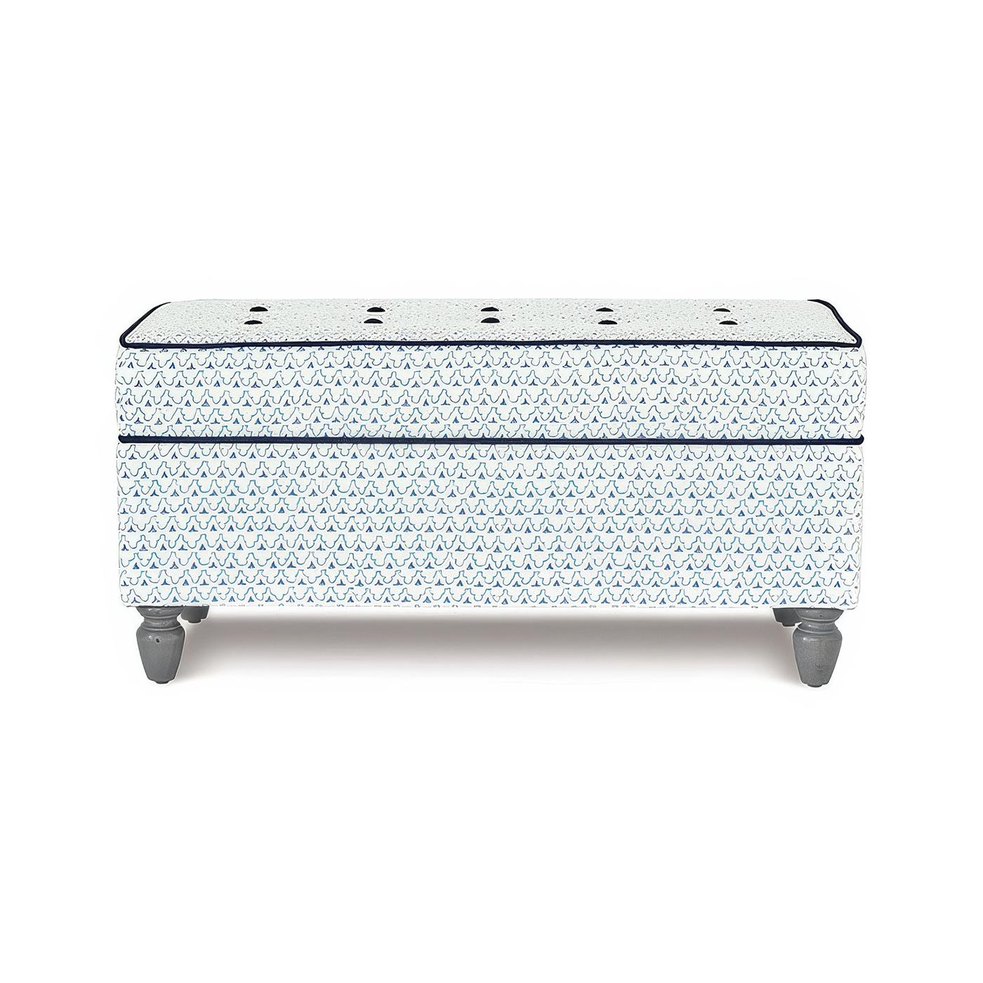 Ottoman blends style and function with its tailored trellis print fabric and hand-tufted details. A plush, high-density foam cushion ensures comfort, while hand-stained Limestone wooden legs add timeless charm.

Designed for versatility, it features