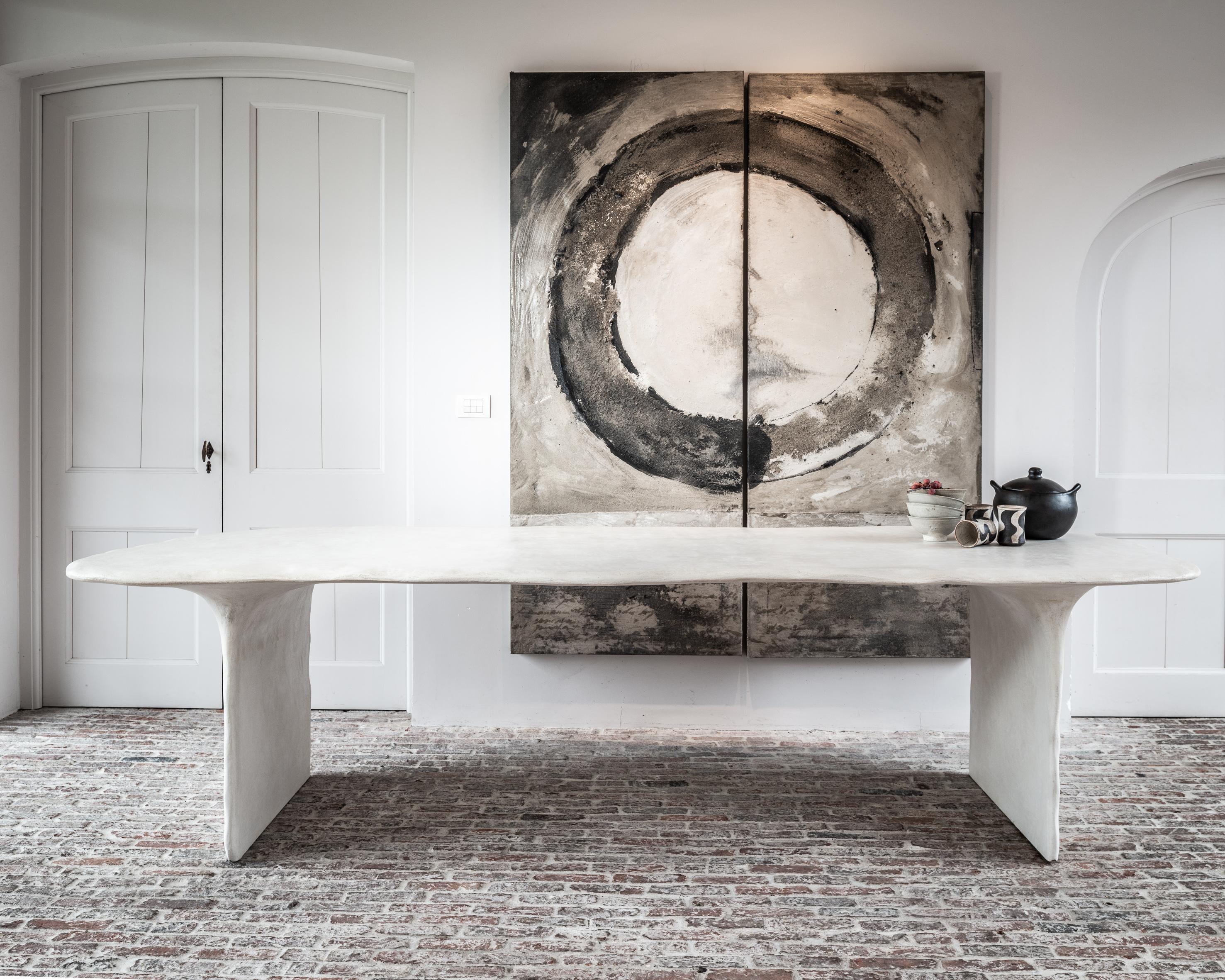 Tremezzo dining table by Studio Emblématique.
Dimensions: W 285 x D 95 x H 76 cm
Materials: Stone grain

Pushing the boundaries, going the extra mile to find the extraordinary piece that defines the space. Embracing craftsmanship and