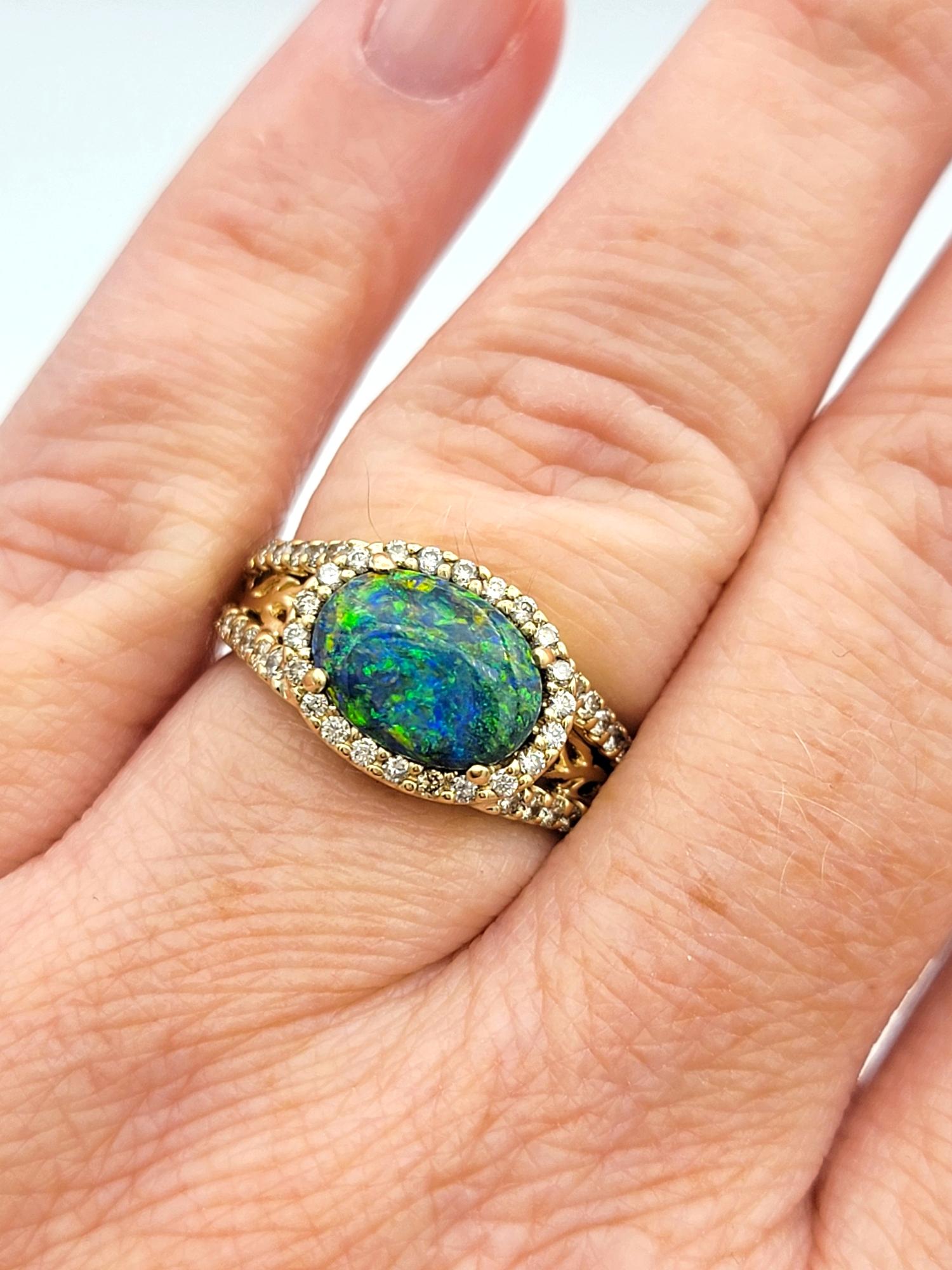 Tremonti East-West Oval Cut Black Opal Ring with Diamond Halo in 14 Karat Gold 5