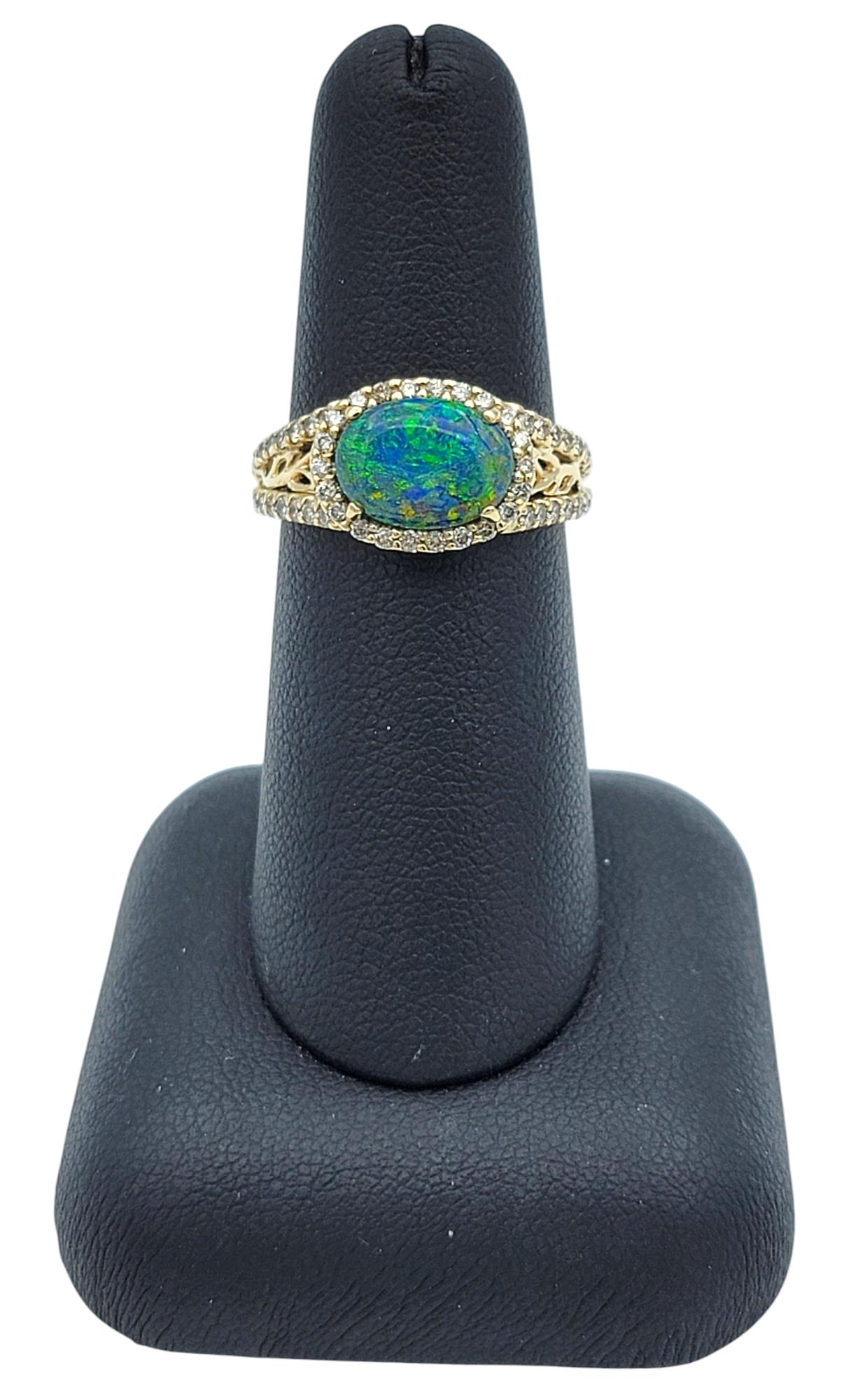 Tremonti East-West Oval Cut Black Opal Ring with Diamond Halo in 14 Karat Gold 6