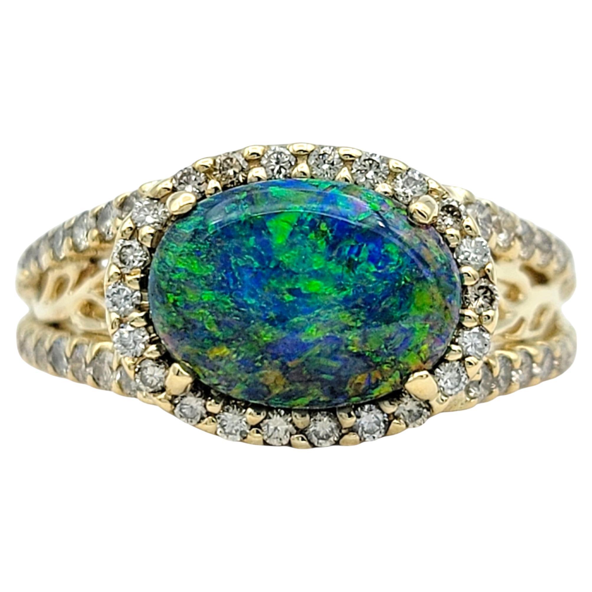 Ring Size: 7

Discover the captivating beauty of this black opal and diamond ring, elegantly set in 14 karat yellow gold. At its center, a mesmerizing oval-cut black opal showcases a stunning play of colors, radiating an almost magical allure.