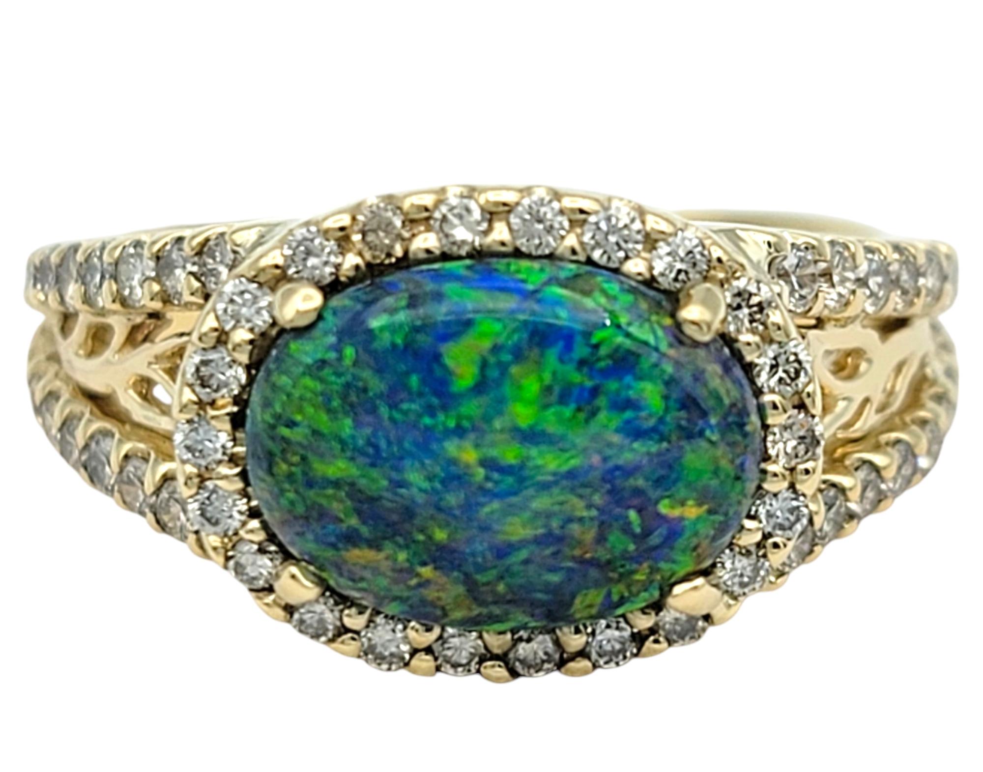 Contemporary Tremonti East-West Oval Cut Black Opal Ring with Diamond Halo in 14 Karat Gold