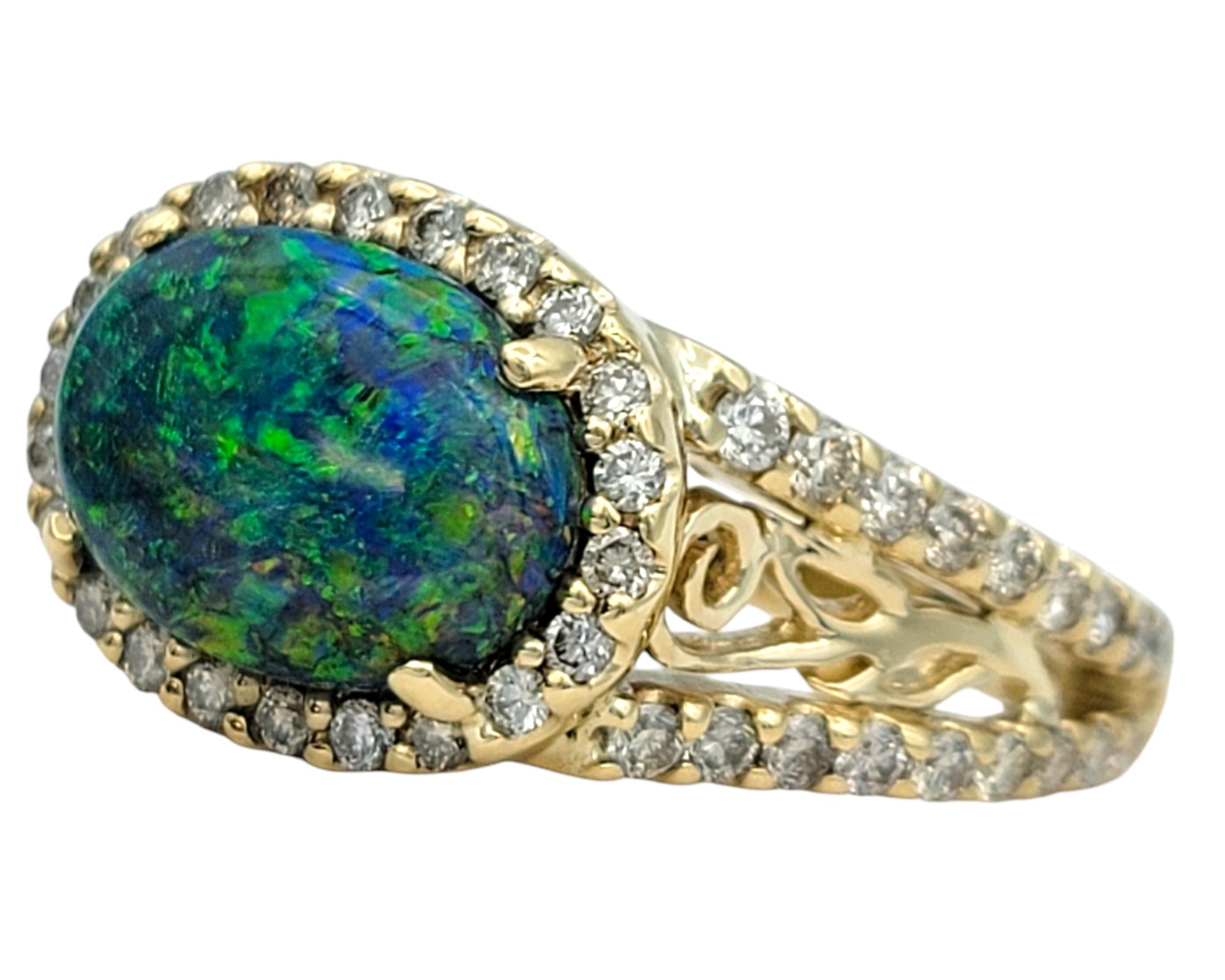 Tremonti East-West Oval Cut Black Opal Ring with Diamond Halo in 14 Karat Gold In Good Condition In Scottsdale, AZ
