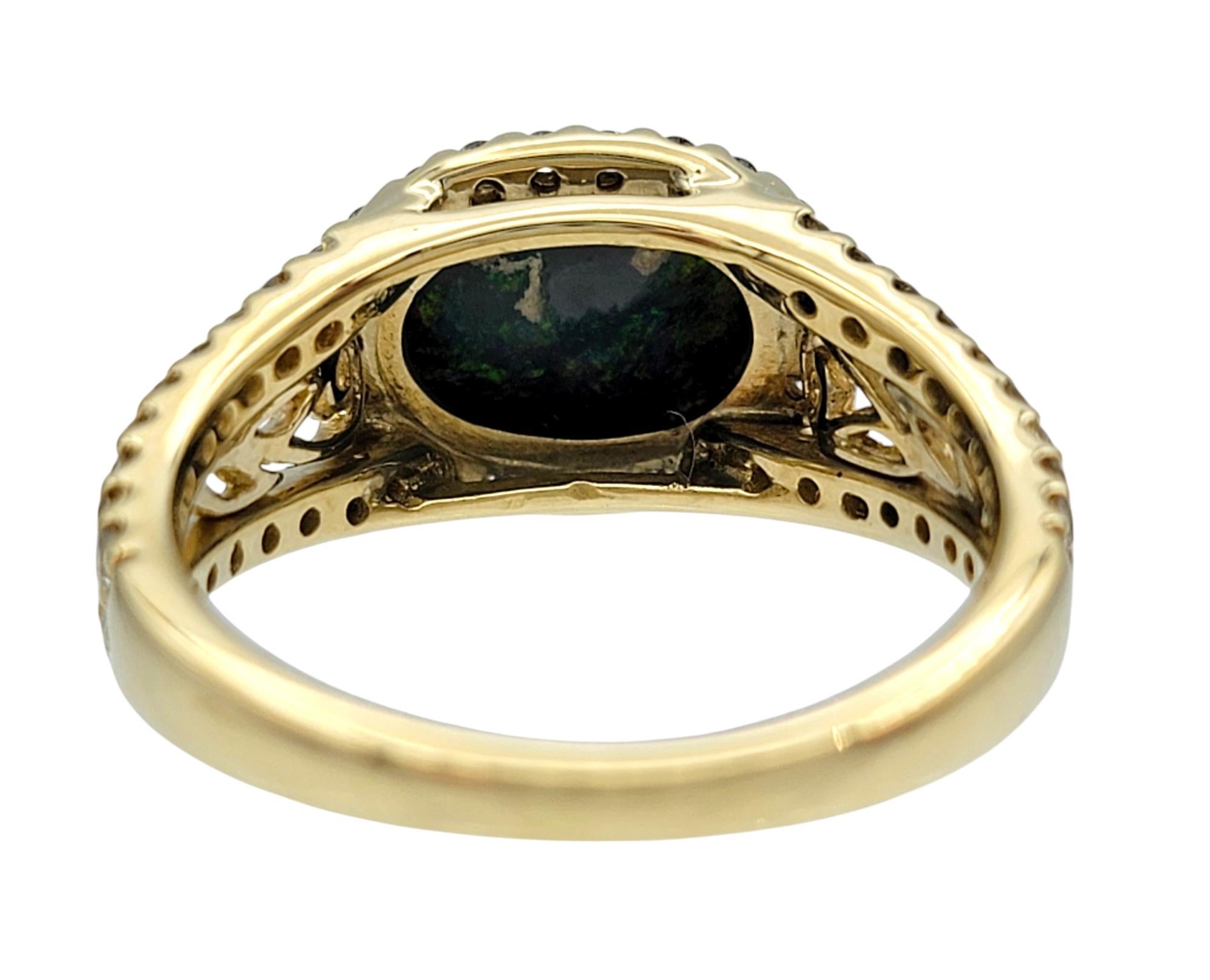 Tremonti East-West Oval Cut Black Opal Ring with Diamond Halo in 14 Karat Gold 1