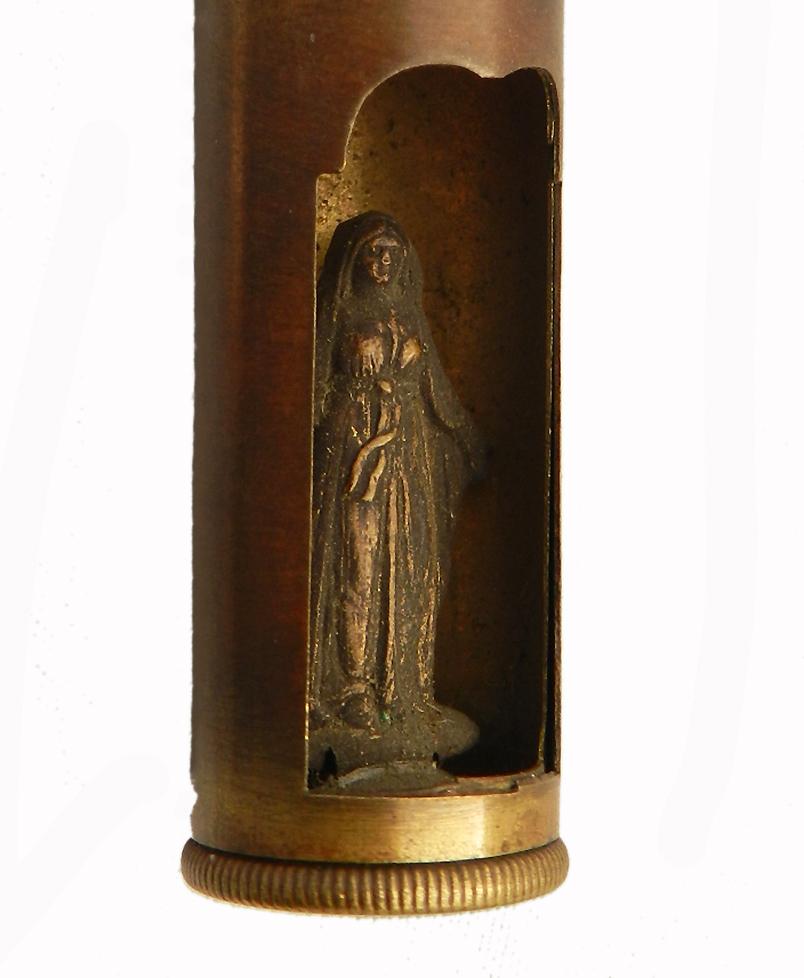 Rare trench art bullet World War One with hidden Virgin Mary,
circa 1914-1918
Created by a WWI soldier, the bottom of the bullet turns to open an inner door revealing the Virgin Mary inside
It was made to be worn round the neck
Very unusual and