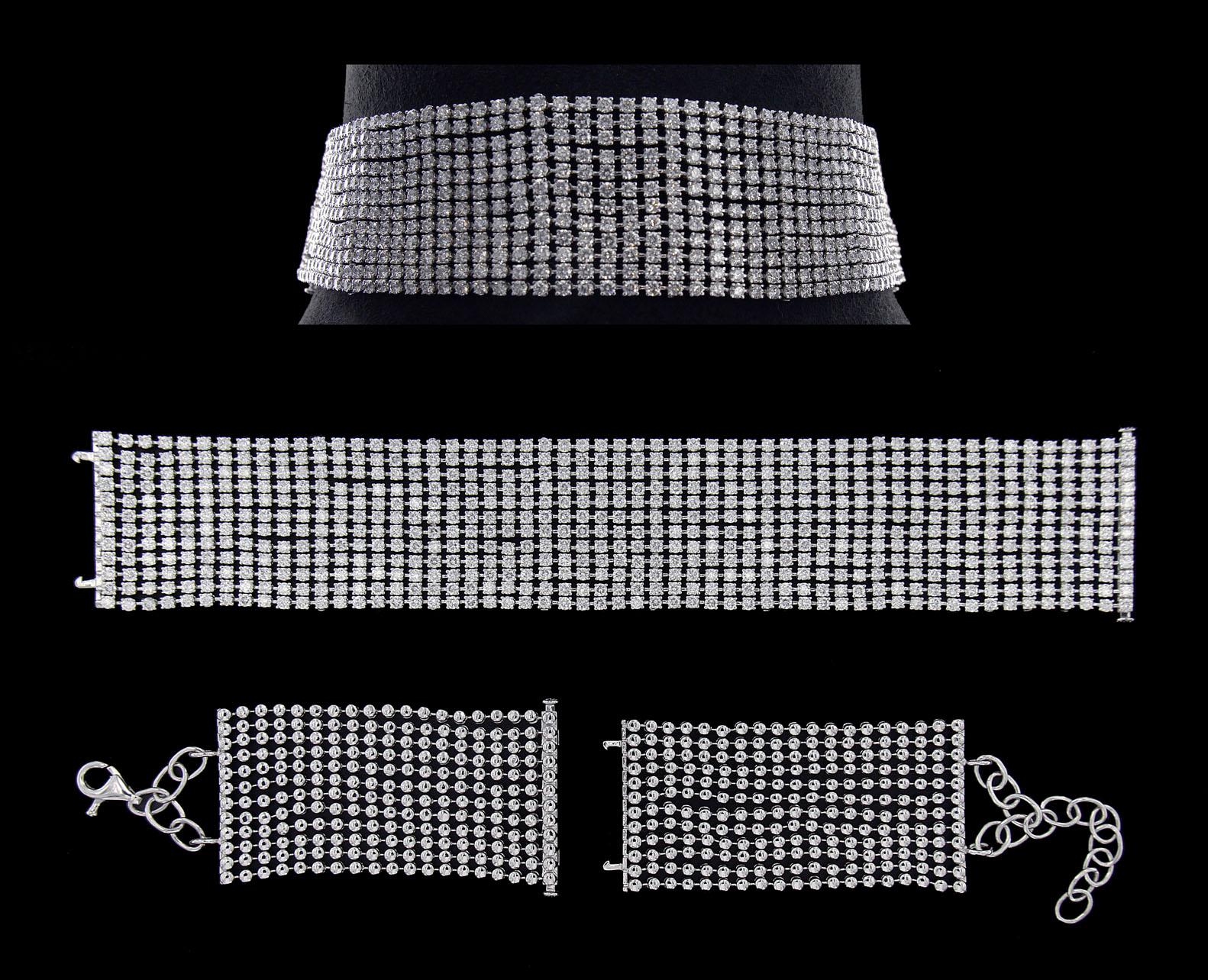 Trendy 18 Karat White Gold and Diamond Choker Necklace

Diamonds of approximately 25.710 carats, mounted on 18 karat white gold choker necklace. The Necklace weighs approximately 96.408 grams.

Please note: The charges specified do not include any