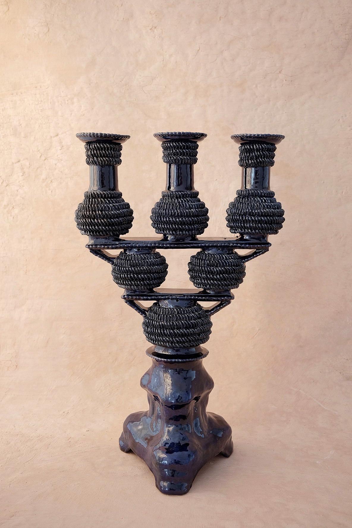 Tres Luces candleholder by Onora
Dimensions: W 28 x H 45.7 cm
Materials: Clay, Glazed pottery

Hand sculpted clay, covered with a mineral based slip and burnished using a quartz stone. The “Circo Collection” is a reproduction of Herón Martínez