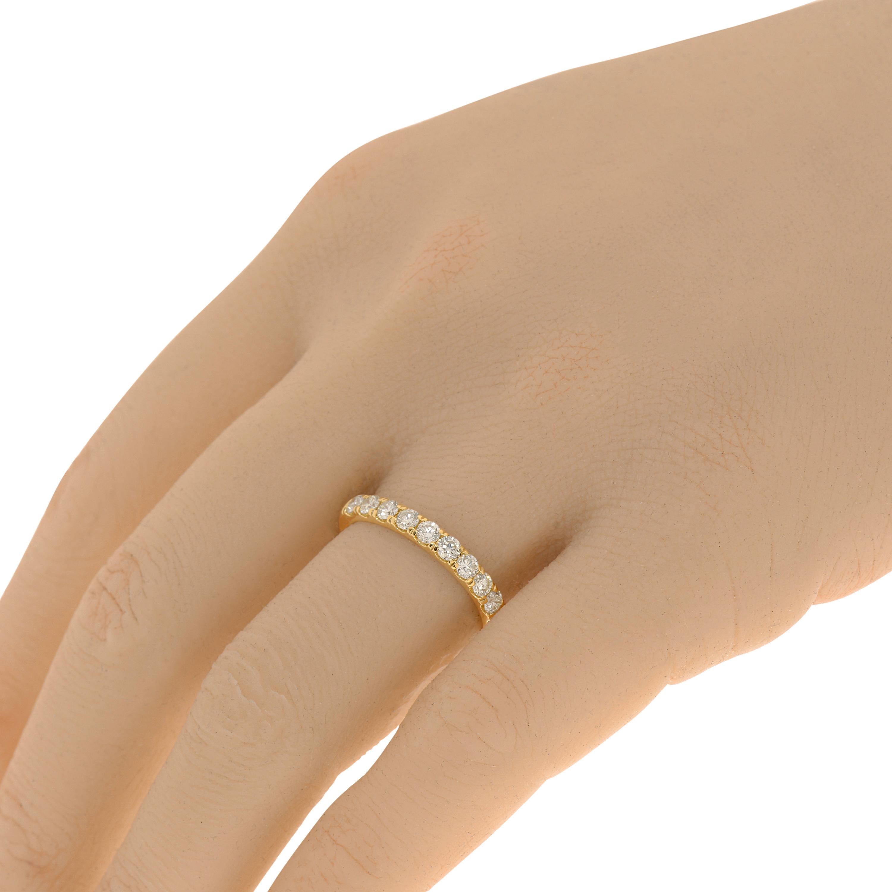 Tresorra 18k yellow gold band ring features 0.74ct. tw. diamonds with a color H and clarity VS-SI1. The ring size is 7 (54.4). The total weight is 3g.
