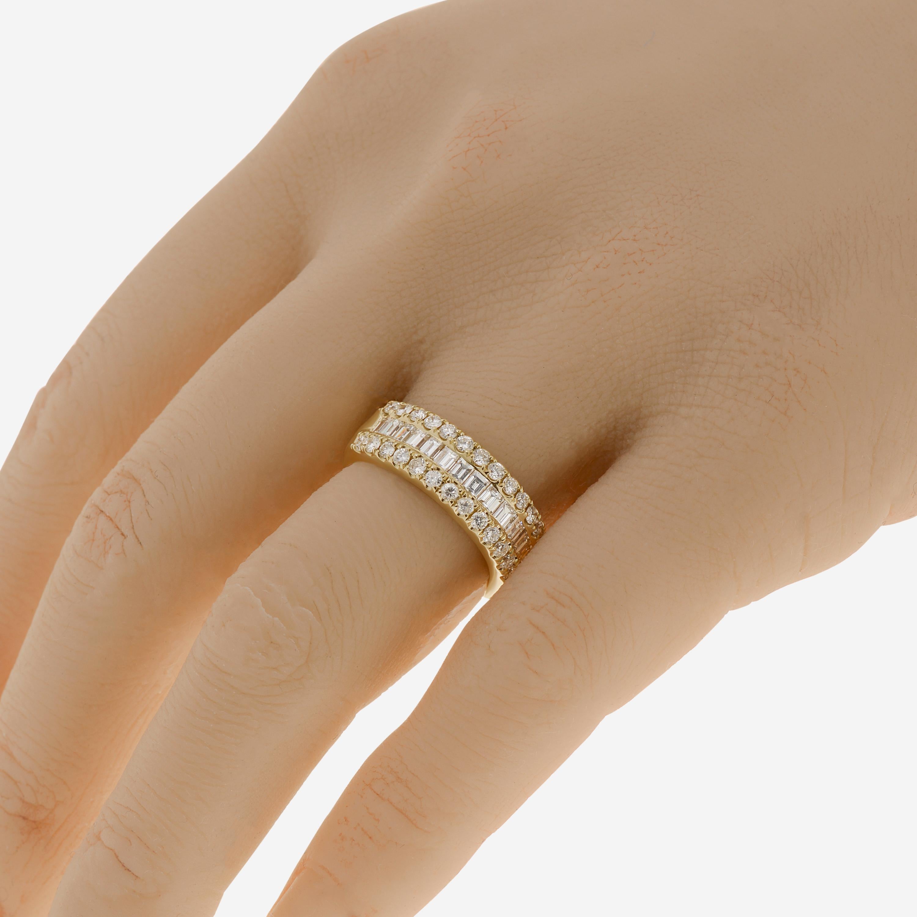 Tresorra 18k yellow gold band ring features 1.54ct. tw. diamonds with a color G-H and clarity SI1. The ring size is 6.25 (52.6). The total weight is 7.7g.
