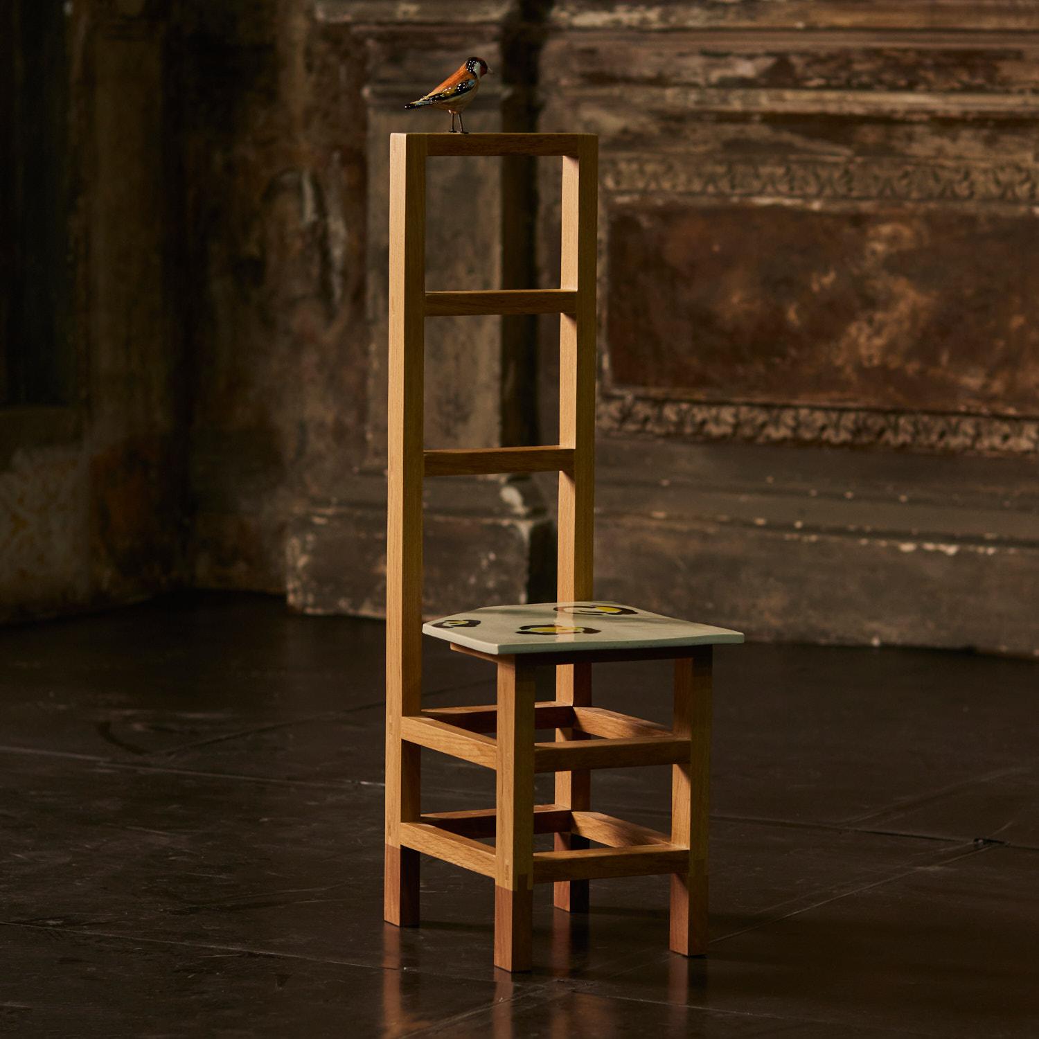 Trespolo is a made to order sculptural chair designed by Ennio Nonni for FragilEdizioni. The hand crafted structure is made from wood, detail as bird is made from ceramic and could be realistic or fully golden , while seating a is a ceramic tile