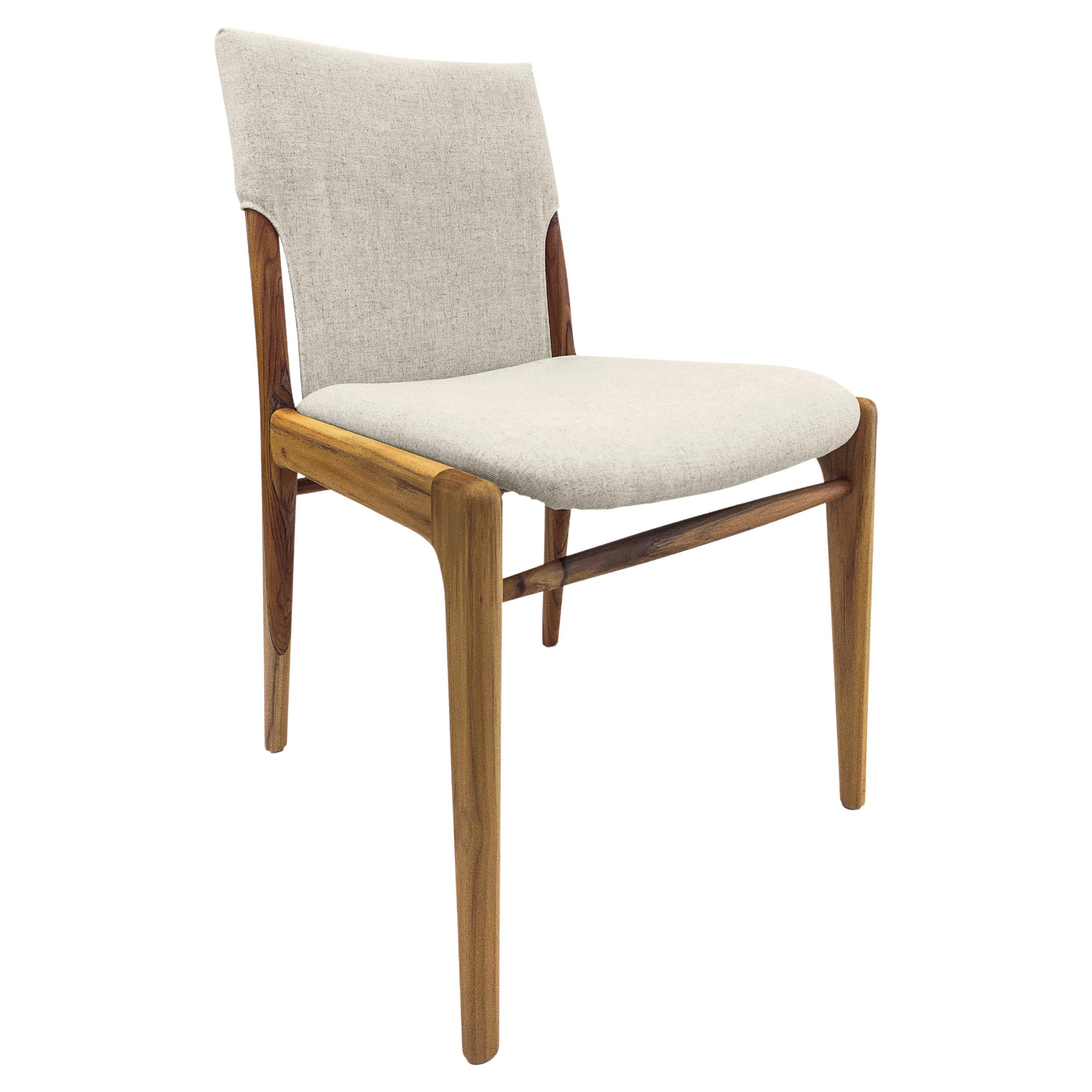 Legendary Uultis designer Mr. Sergio Batista has created the Tress dining chair in a linen fabric upholstered and a teak wood finish. His creations are synonymous with style, elegance, comfort, and quality. With the Tress chair, Mr. Batista has