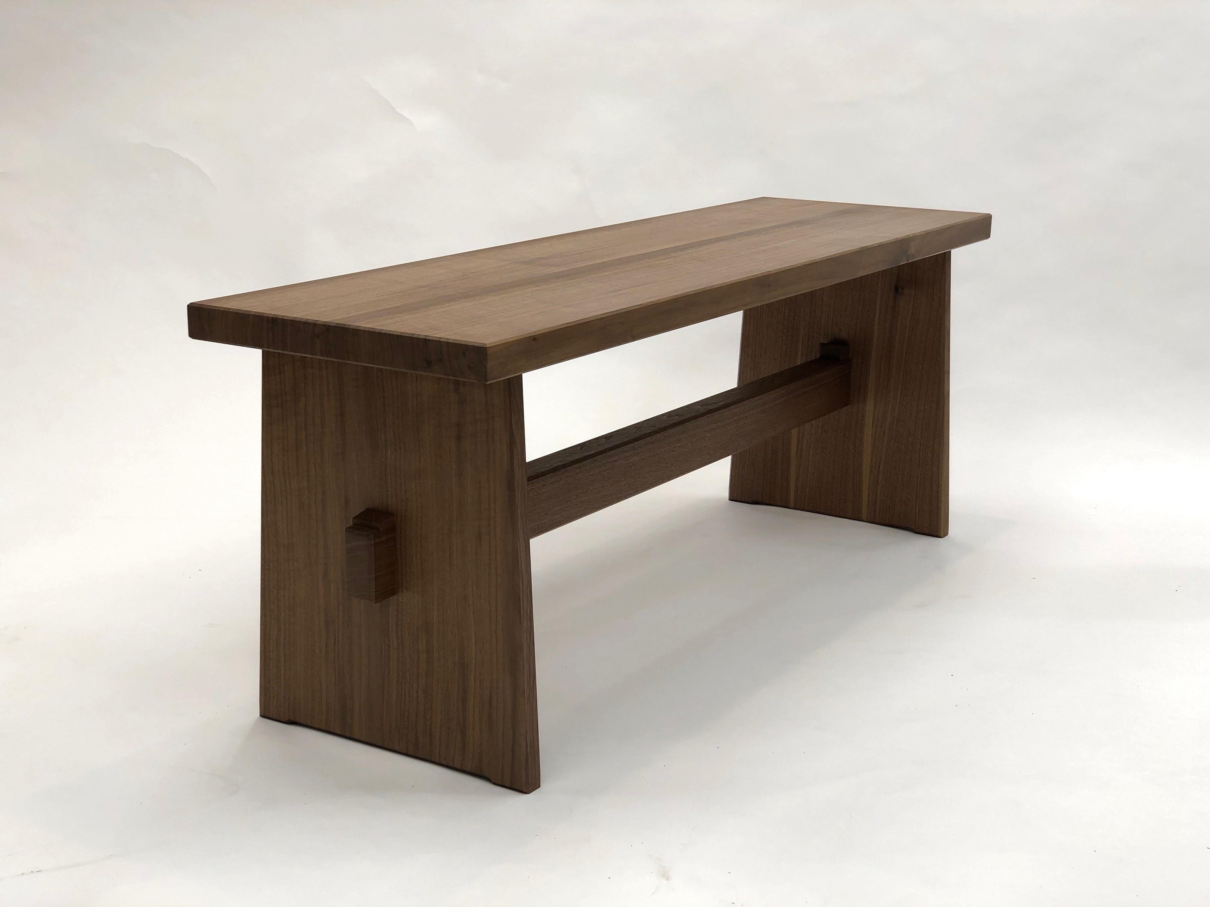 Trestle base bench in quarter sawn walnut created utilizing the techniques of Japanese temple carpentry. This bench is created using interlocking wooden joinery and without metal fasteners. It is available in a variety of sizes.

Measures: Shown