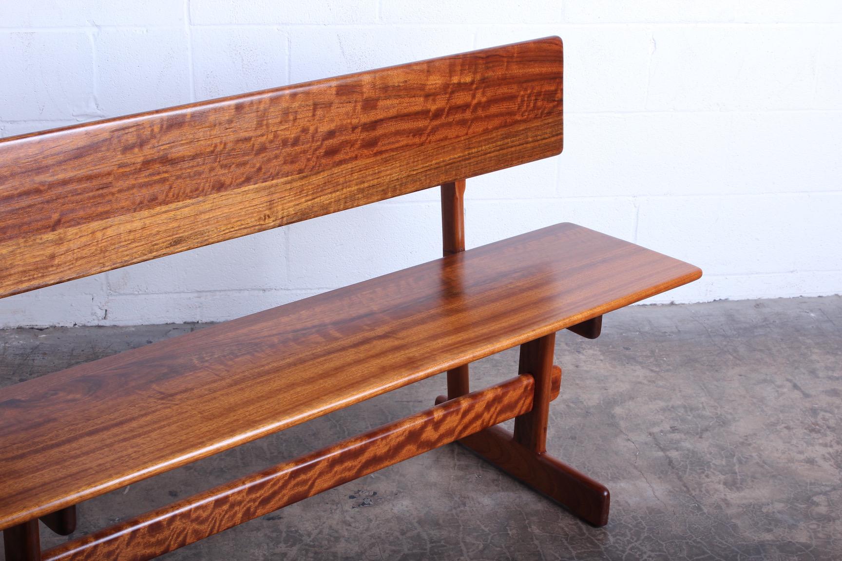 Walnut Trestle Bench by Gerald McCabe For Sale