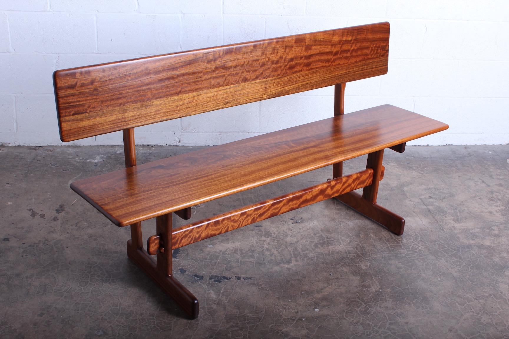 Walnut Trestle Bench by Gerald McCabe For Sale