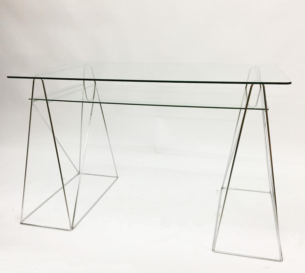 Trestle Leg table desk with two-tiered glass top, 1970s

Chrome and glass desk, 1970s
Trestle leg table, desk with two tiered glass top
The measurement is 80 cm high, 120 cm wide and the depth is 75 cm.

 