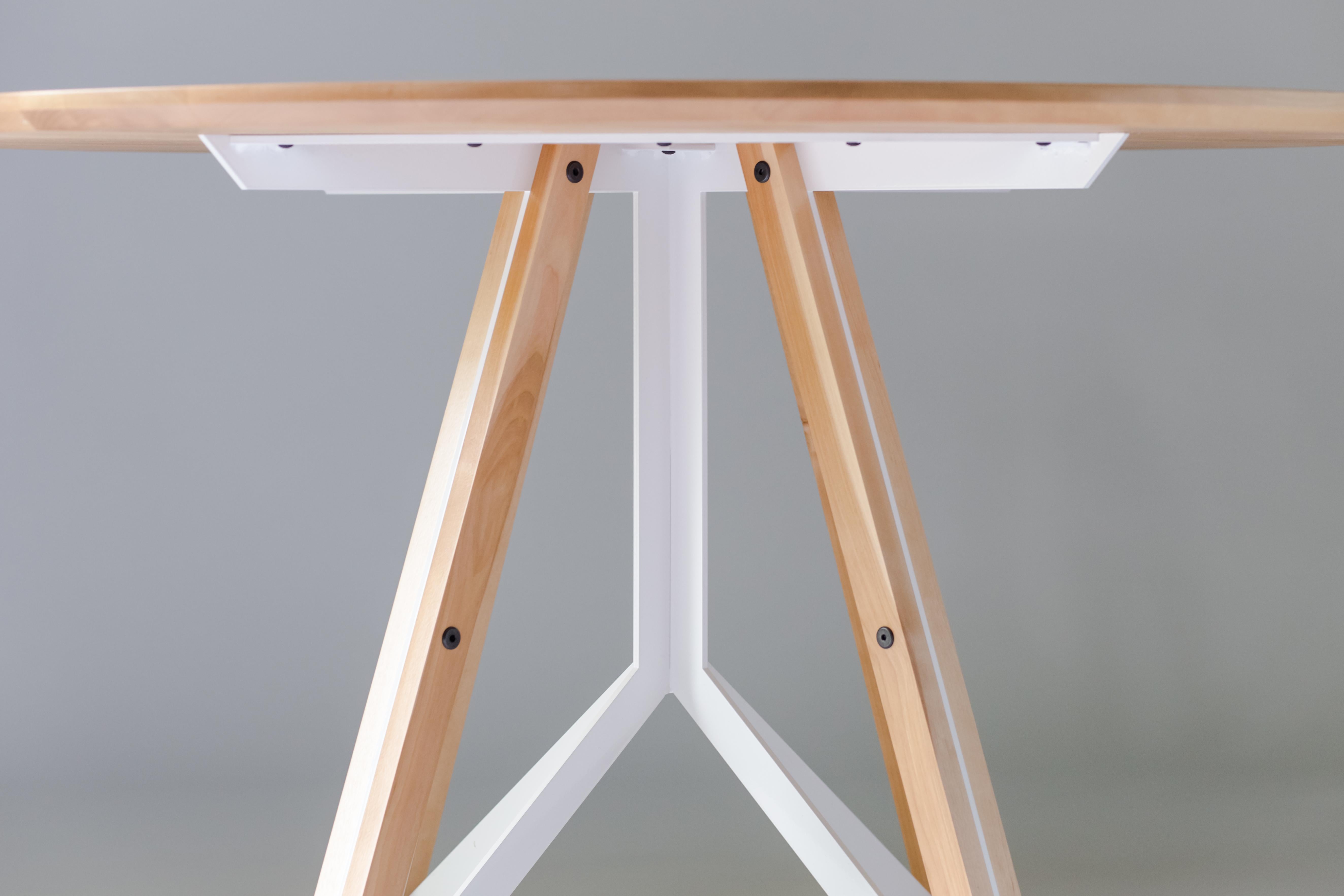 The Trestle - modern birch and powder coated steel round dining table 

Made from solid birch and welded steel, the Trestle takes inspiration from classic bridge construction and the Iconic works of Gustave Eiffel. The steel base structure is