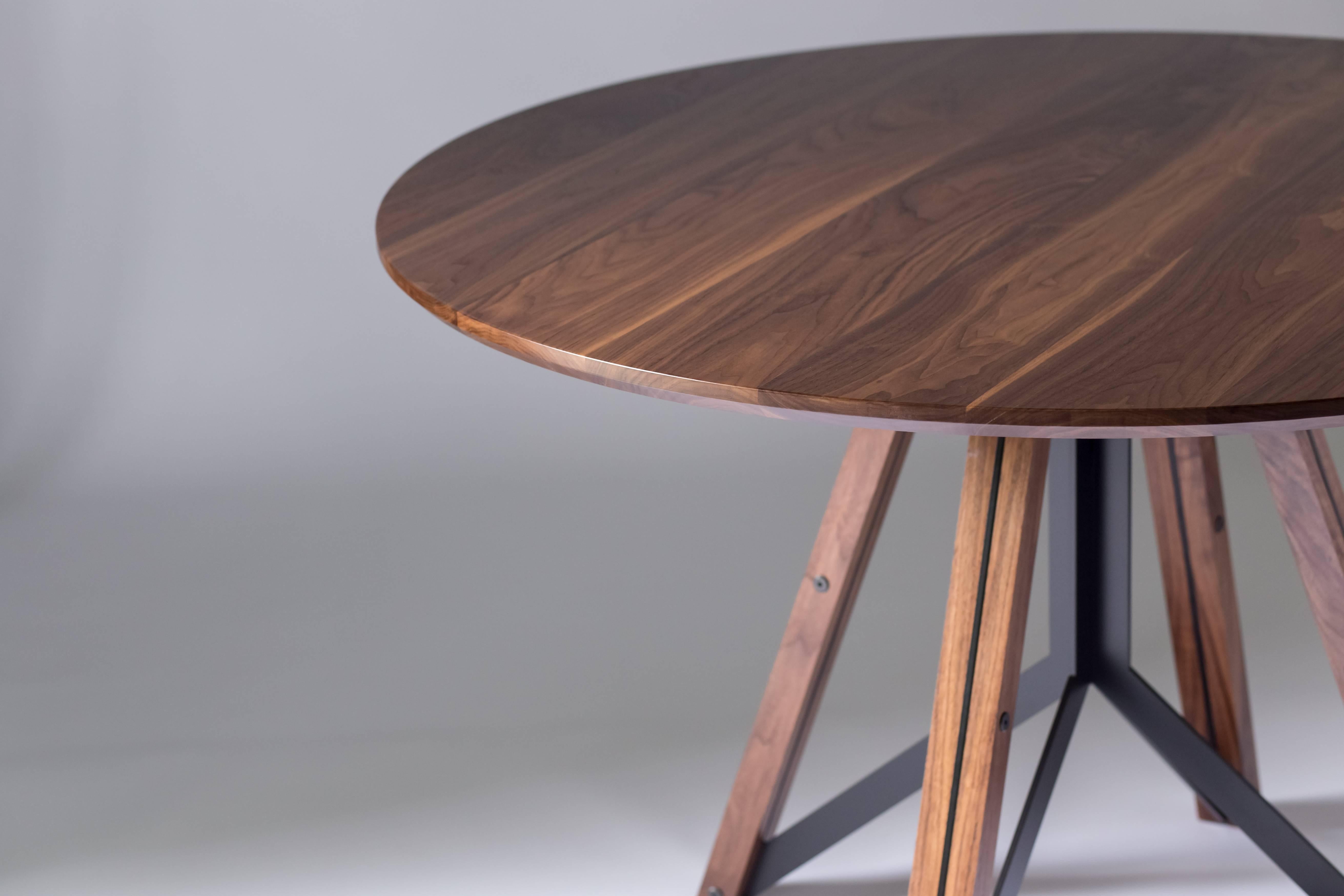 The Trestle - modern walnut, and powder coated steel round dining table

Made from solid walnut and welded steel, the Trestle takes inspiration from classic bridge construction and the Iconic works of Gustave Eiffel. The steel base structure is