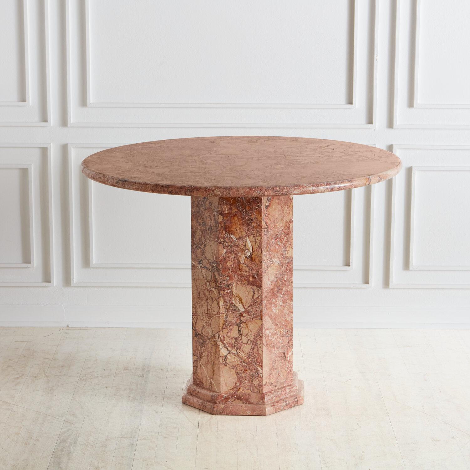A stunning custom marble dining or entryway table designed in house by South Loop Loft. This table features a round top resting on a hexagonal mitered edge base with a banded-edge detail.

This table is available on a Made to Order Basis. It is