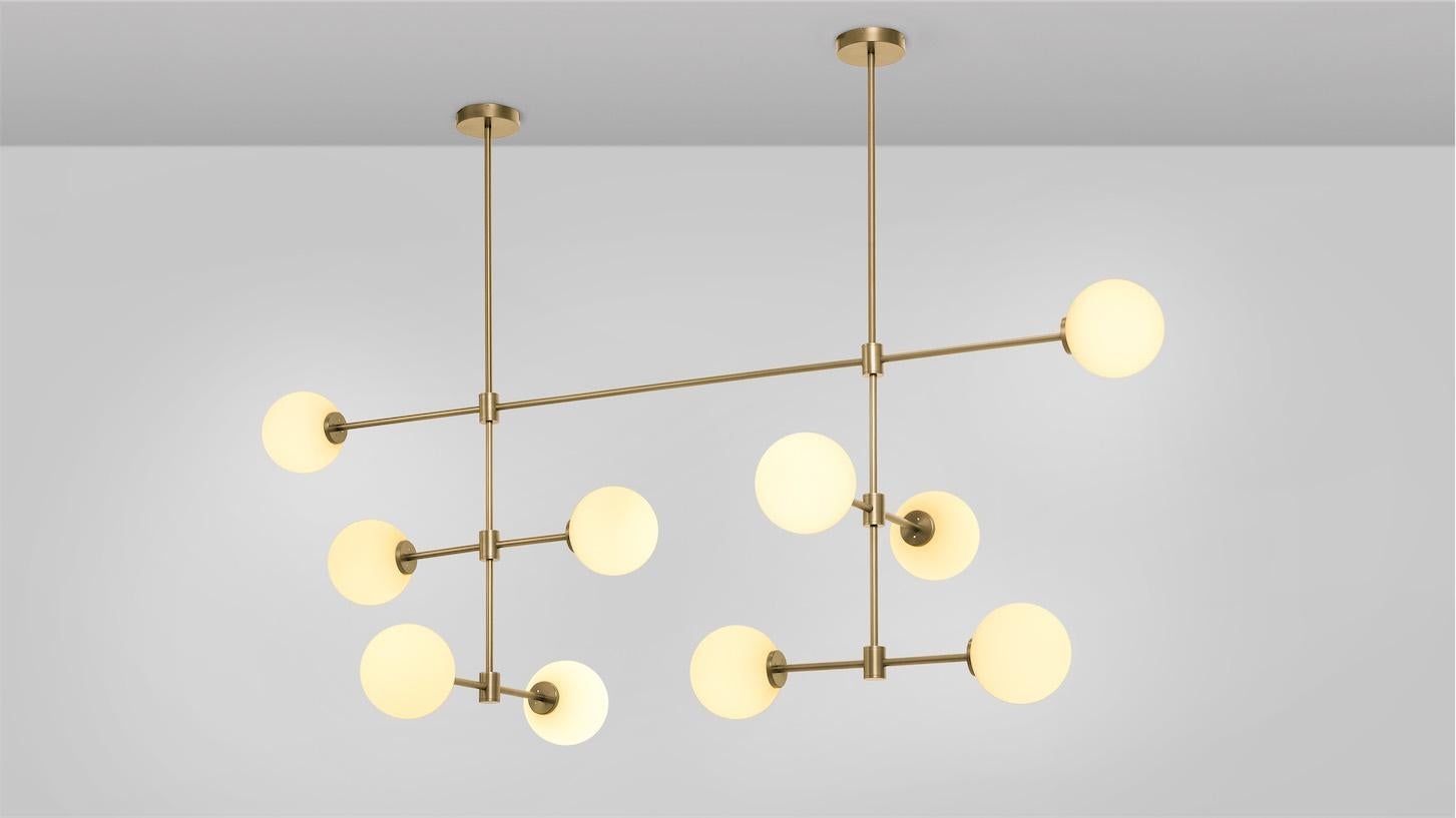 Trevi Multi Arm 10 Pendant by CTO Lighting
Materials: satin brass with matt opal glass shades.
Dimensions: D 64 x W 169 x H 64 cm
Also available in bronze with matt opal glass shades.

A grand statement of graphic precision, the Multi-arm Trevi is a