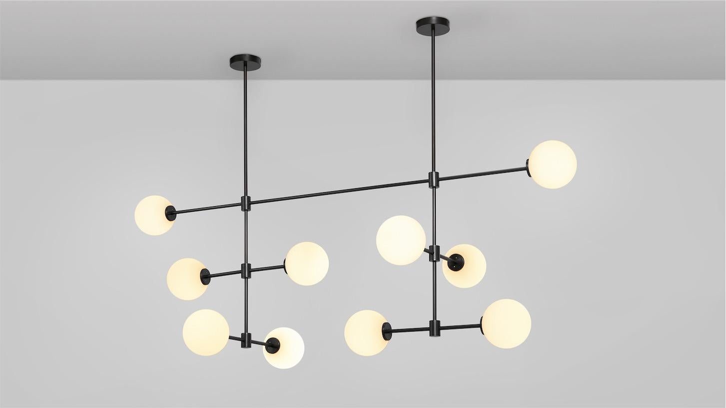 Trevi Multi Arm 10 Pendant by CTO Lighting
Materials: bronze with matt opal glass shades.
Dimensions: D 64 x W 169 x H 64 cm
Also available in satin brass with matt opal glass shades.

A grand statement of graphic precision, the Multi-arm Trevi is a